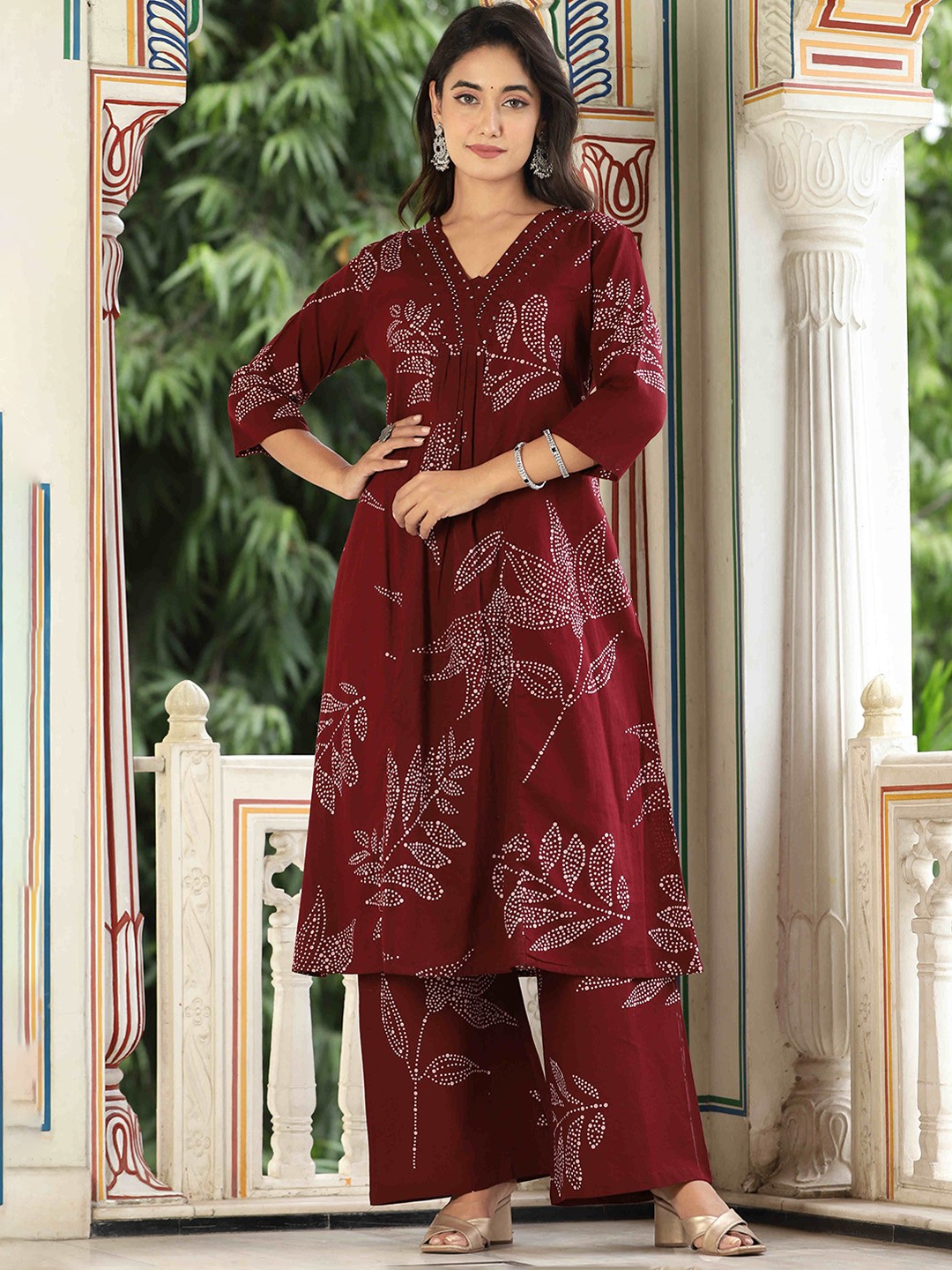 

KALINI Women Floral Printed Regular Beads and Stones Kurta with Palazzos, Maroon
