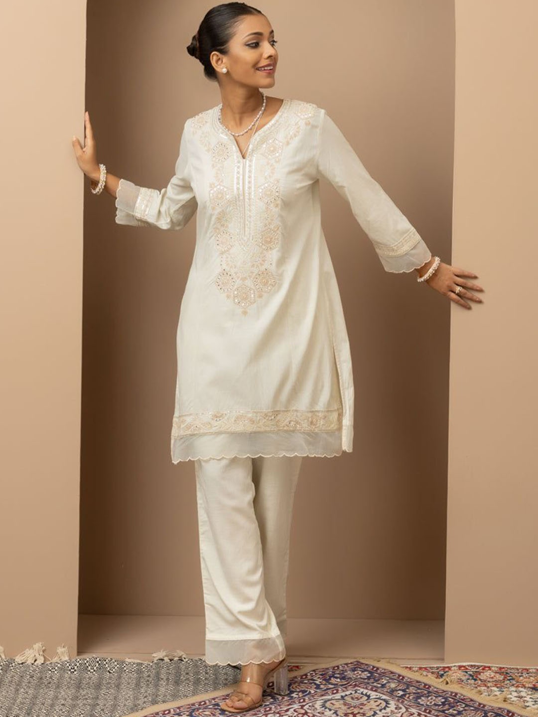 

Lakshita Women Ethnic Motifs Embroidered Regular Thread Work Kurti with Trousers, Off white