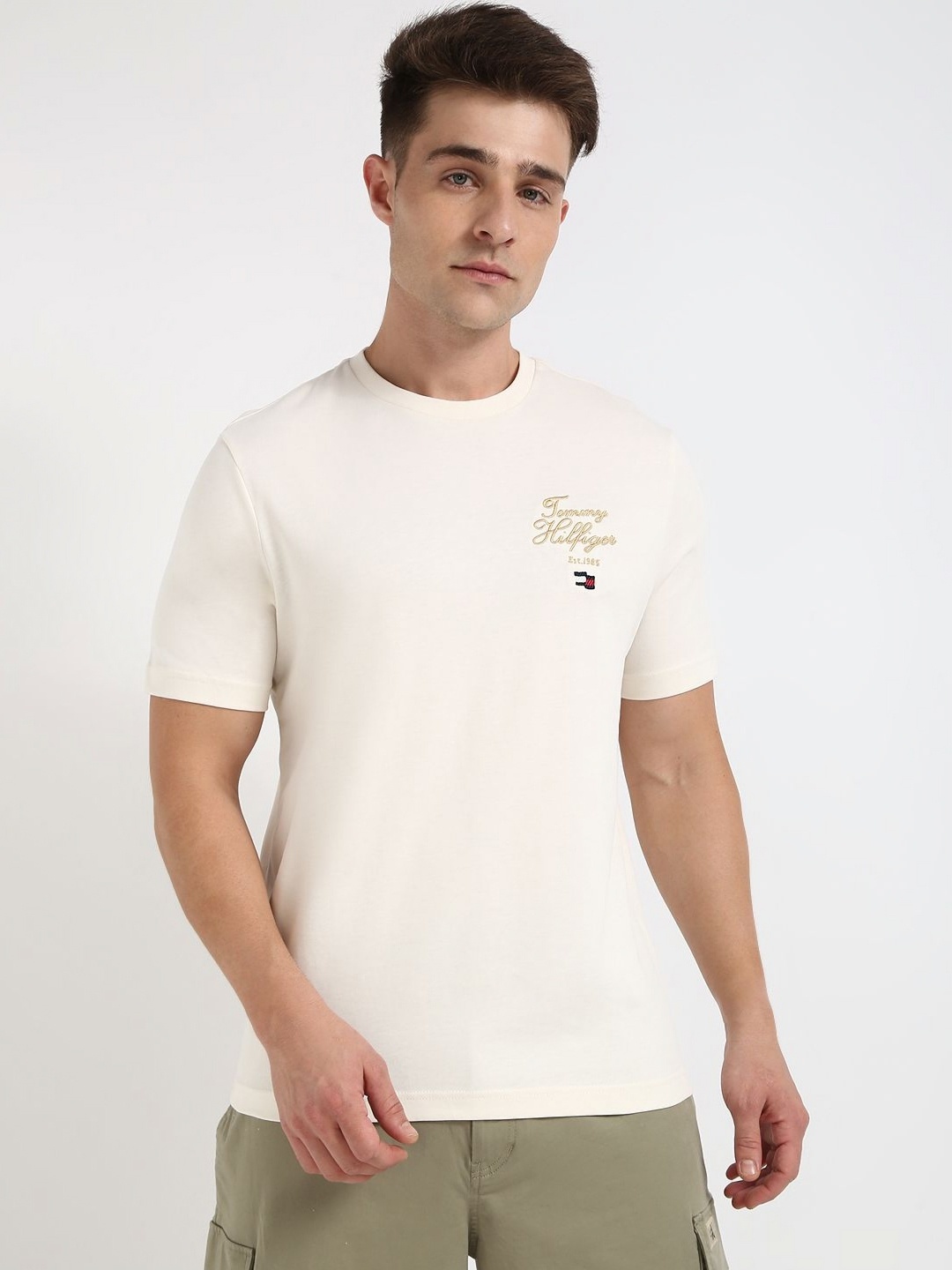 

Tommy Hilfiger Men Solid Round Neck Cotton T-shirt, Off white