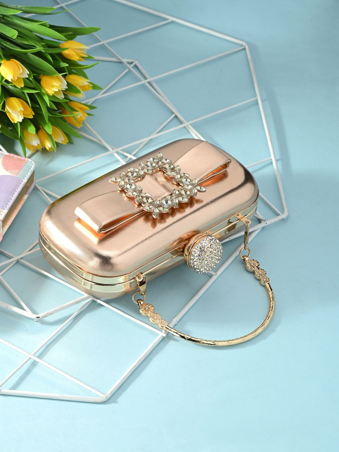 

Sangria Bucckle Diammond Capsule Clutches, Copper