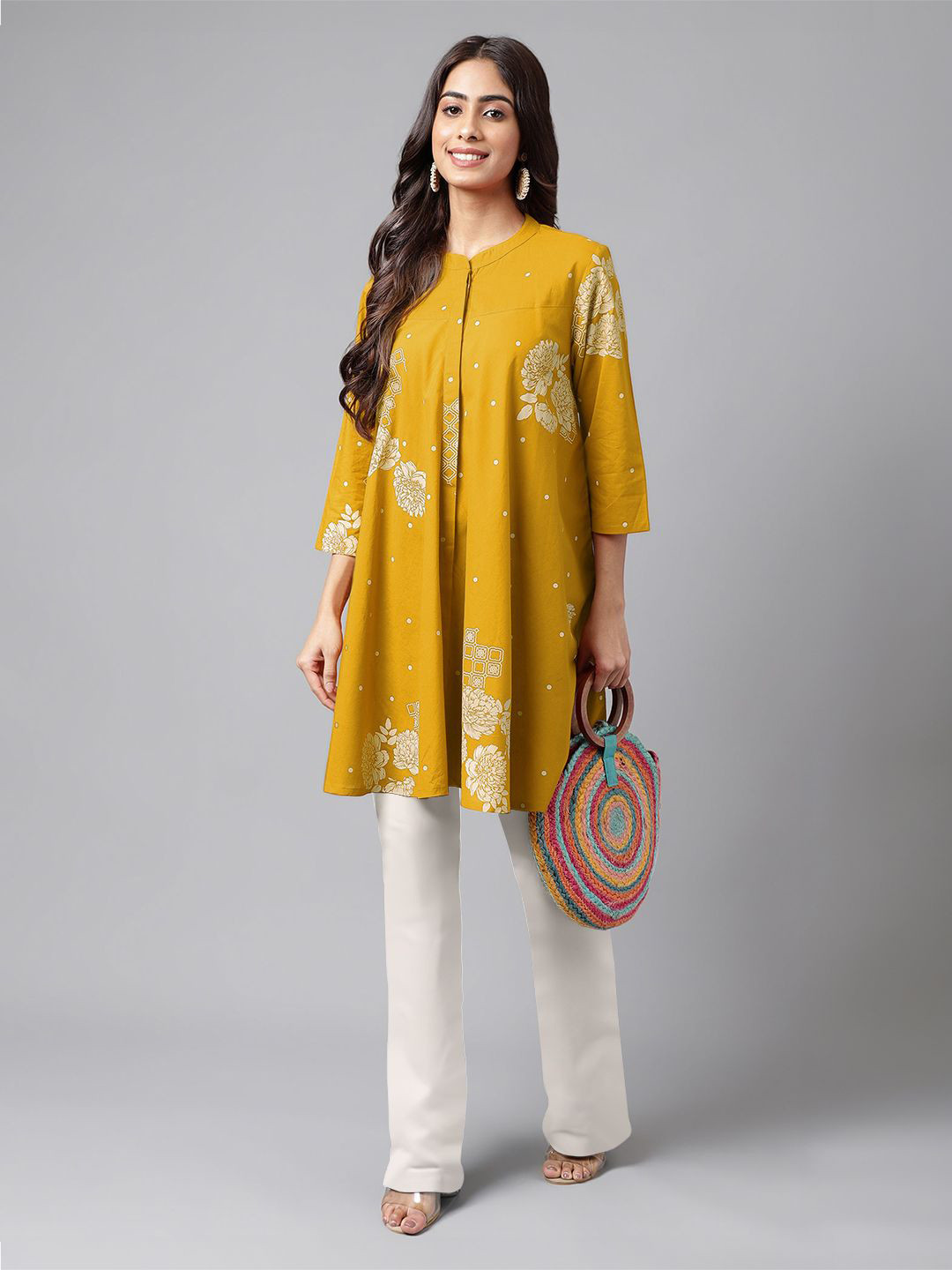 

Janasya Women Pure Cotton Floral Printed Flared Tunic, Mustard