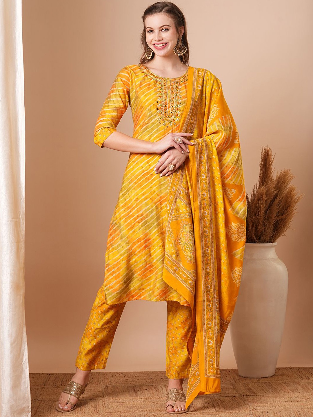 

FASHOR Women Leheriya Printed Regular Thread Work Kurta with Trousers & With Dupatta, Yellow
