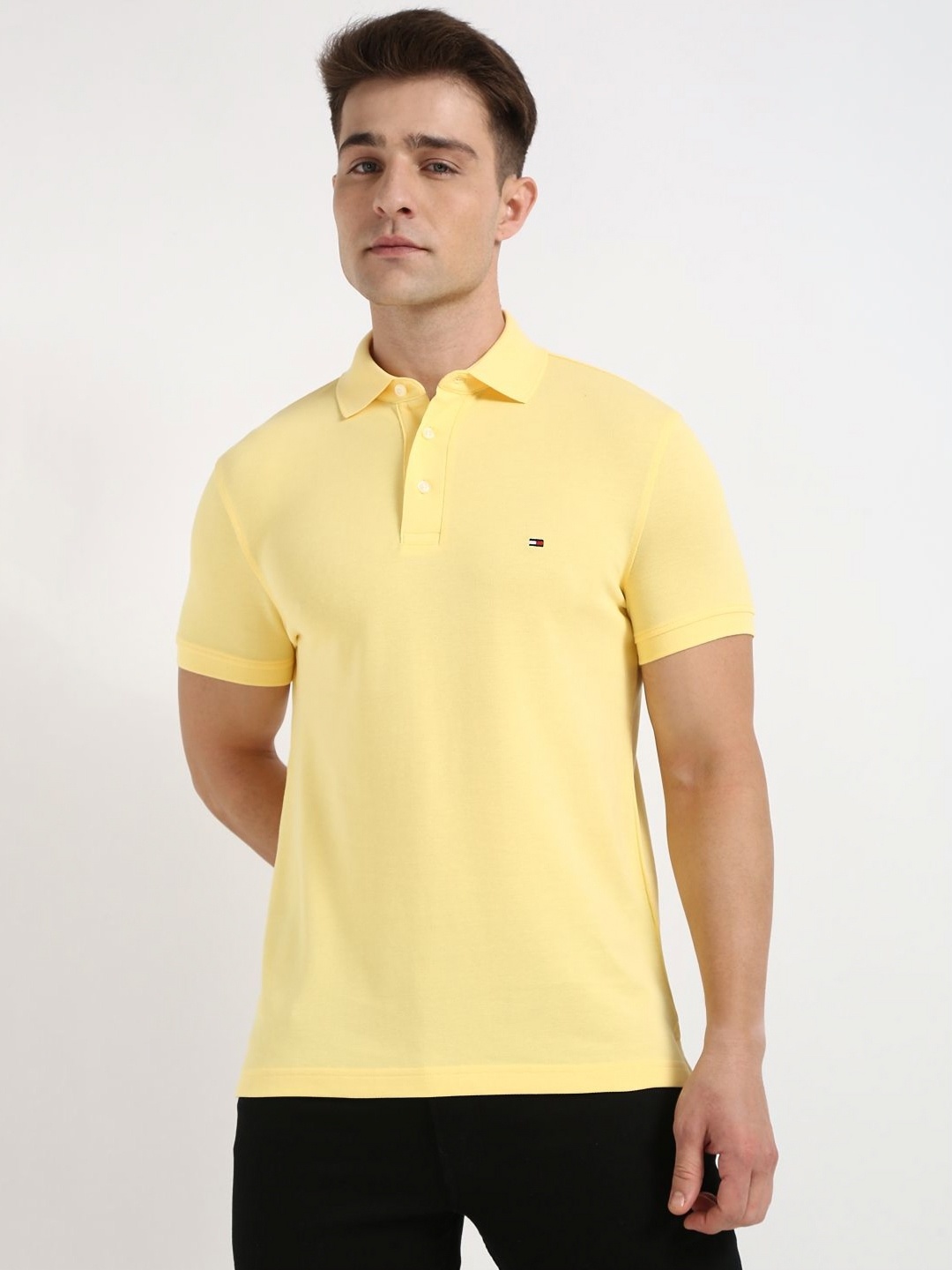 

Tommy Hilfiger Men Solid Polo Collar Cotton Slim Fit T-shirt, Yellow