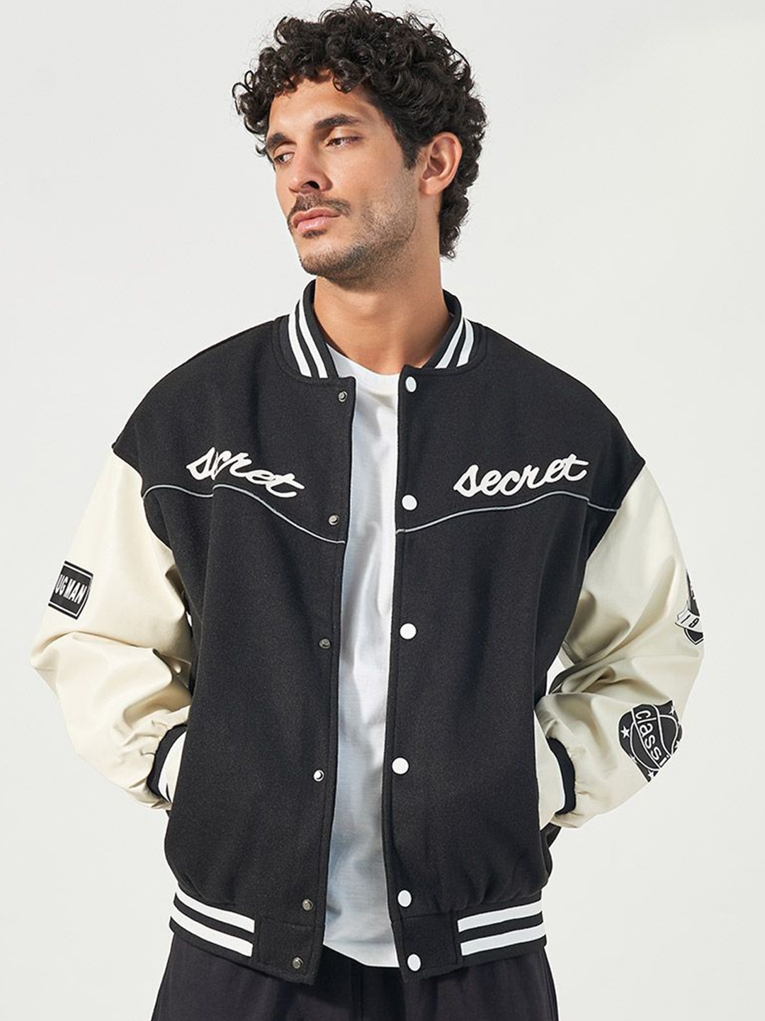 

Styli Men Varsity Bomber Jacket with Multi Badge detail, Black