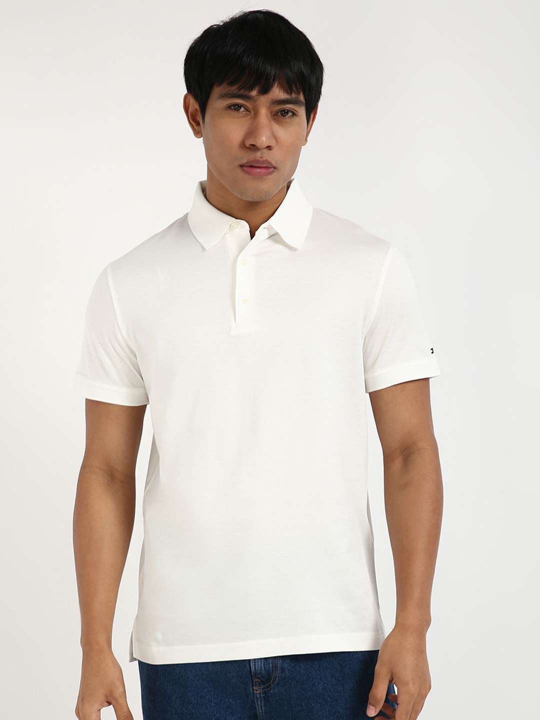 

Tommy Hilfiger Men Solid Polo Collar Cotton Slim Fit T-shirt, Off white