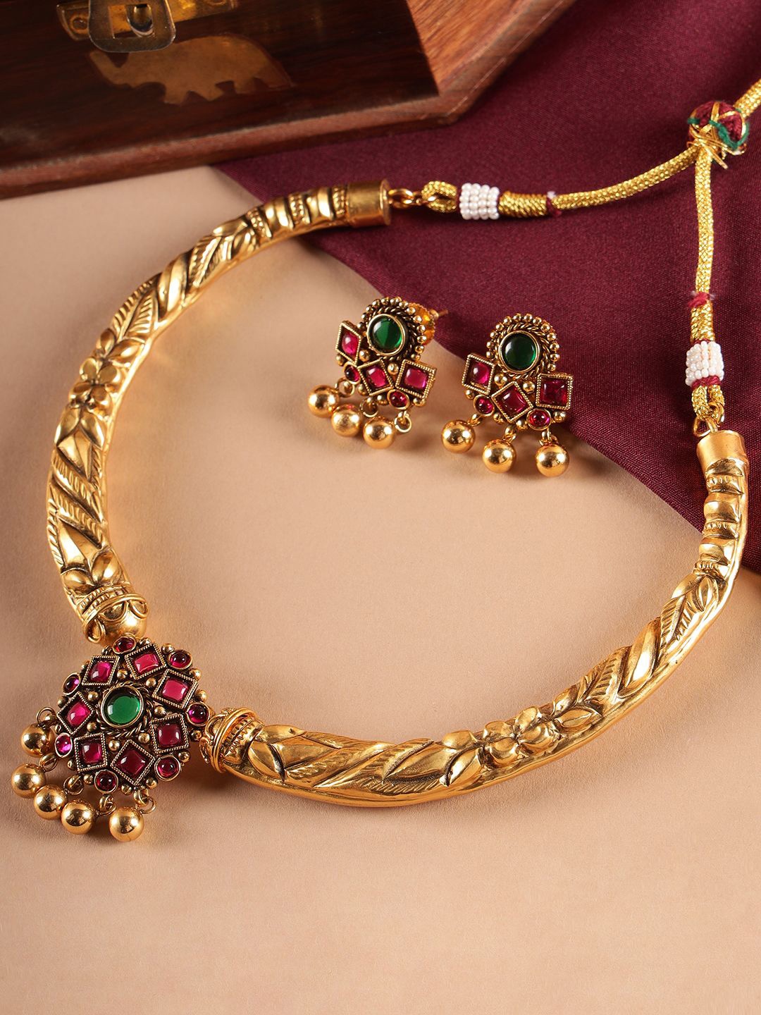 

Kattam Gold-Plated Stone Studded & Beaded Jewellery SetJewellery Set
