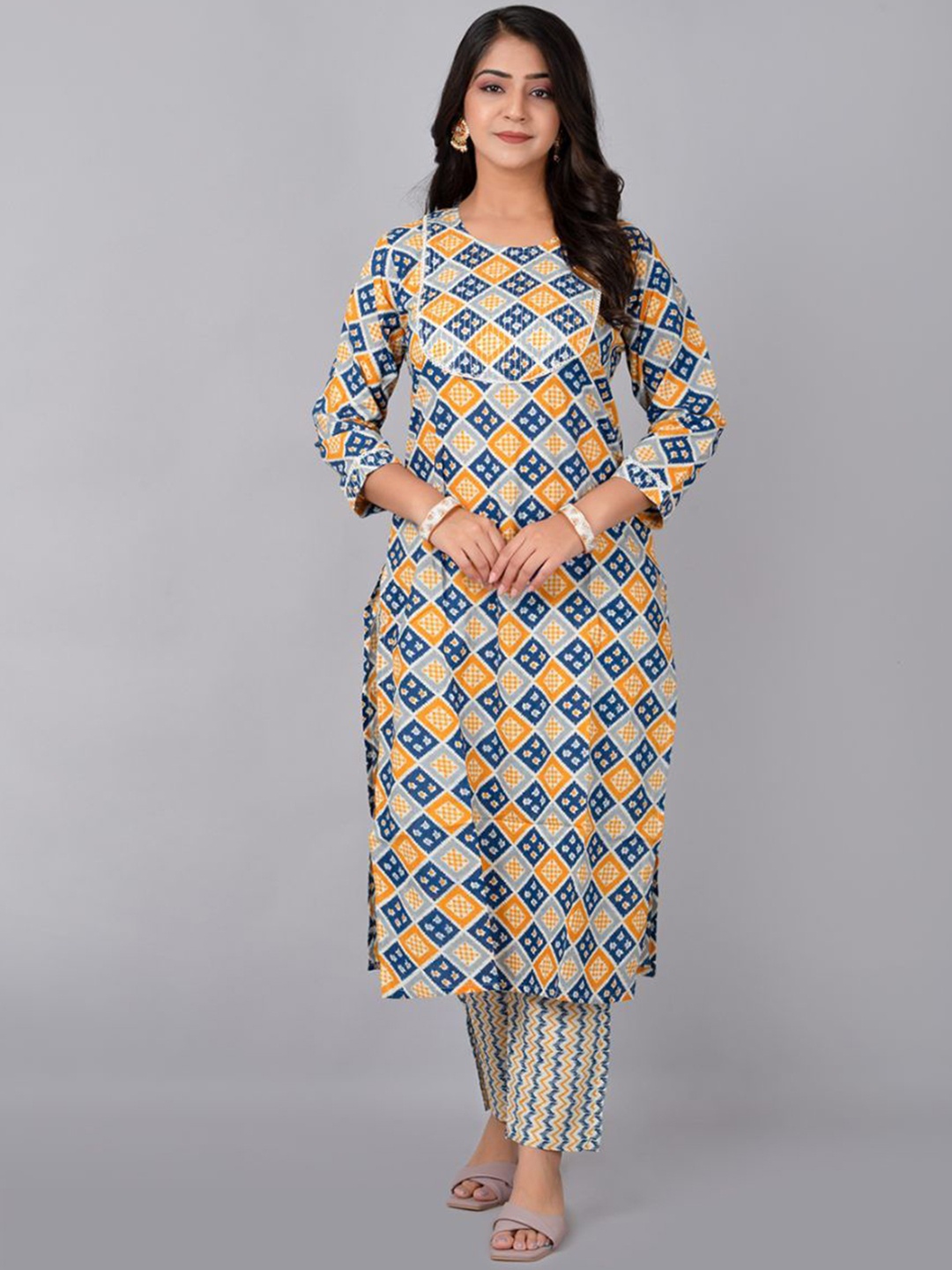 

Fashion Petals Women Ethnic Motifs Printed Regular Kurta with Trousers, Yellow