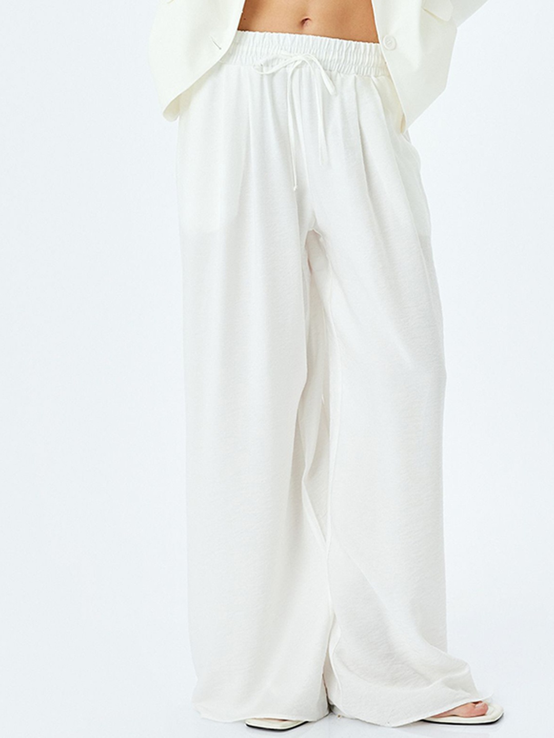 

Koton Women Solid Slip-On Regular Trousers, Off white