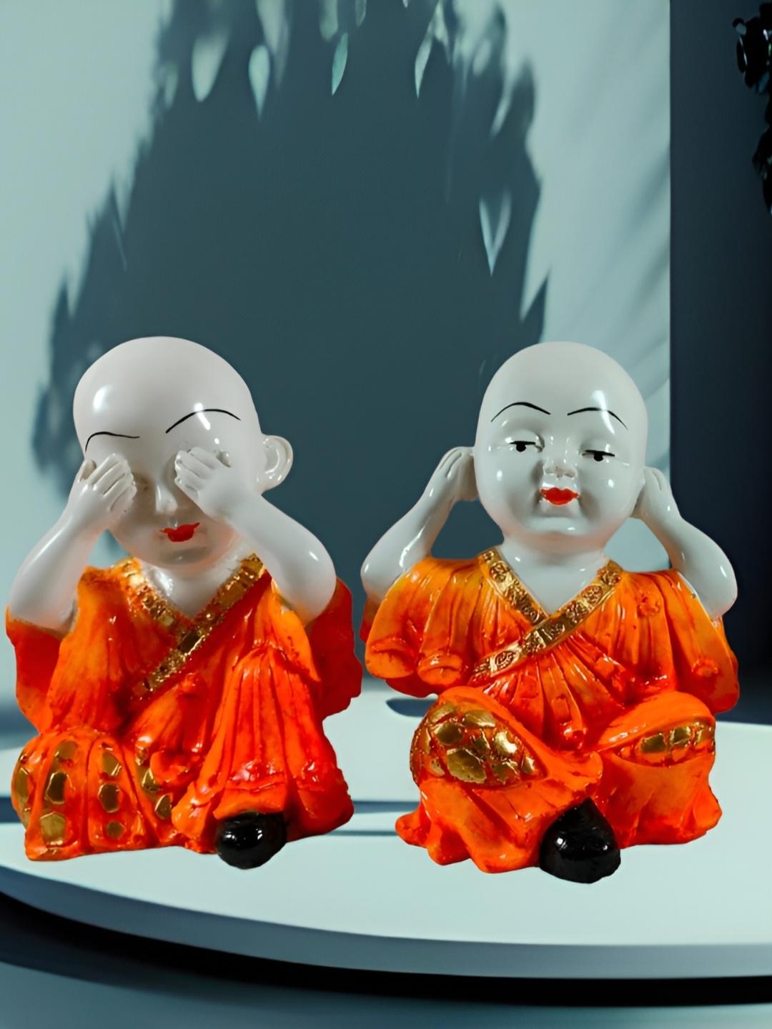 

Vrinban International Orange Figurine Showpiece