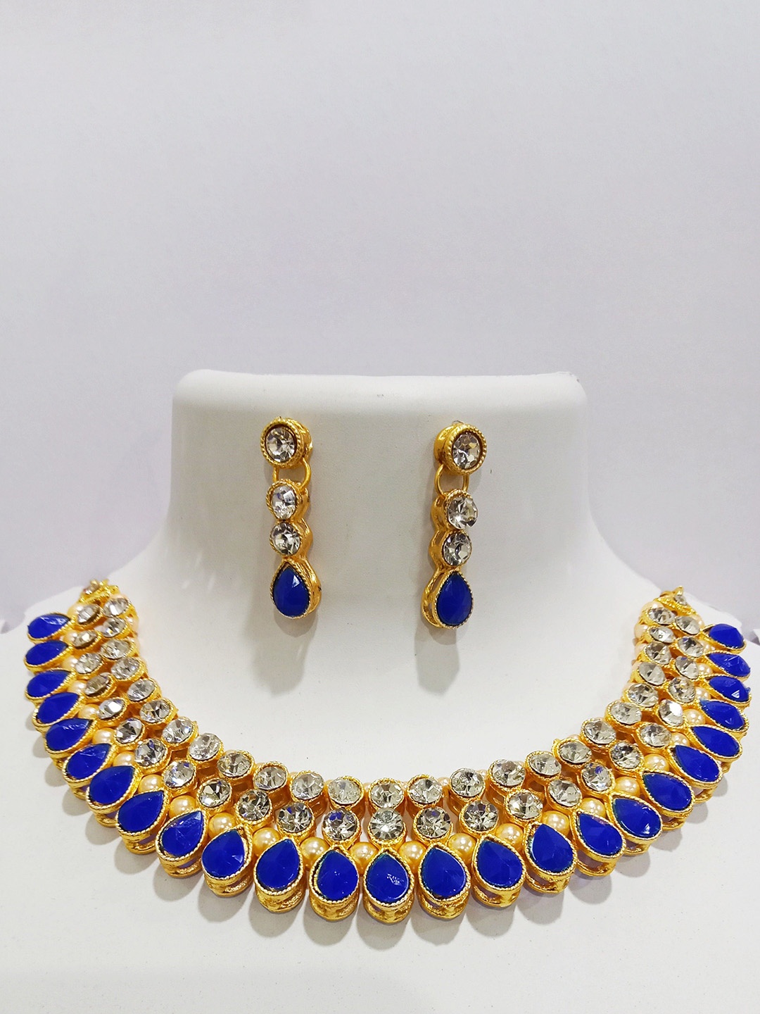 

Gyaan Jewels Gold-Plated Stone Studded & Beaded Jewellery Set