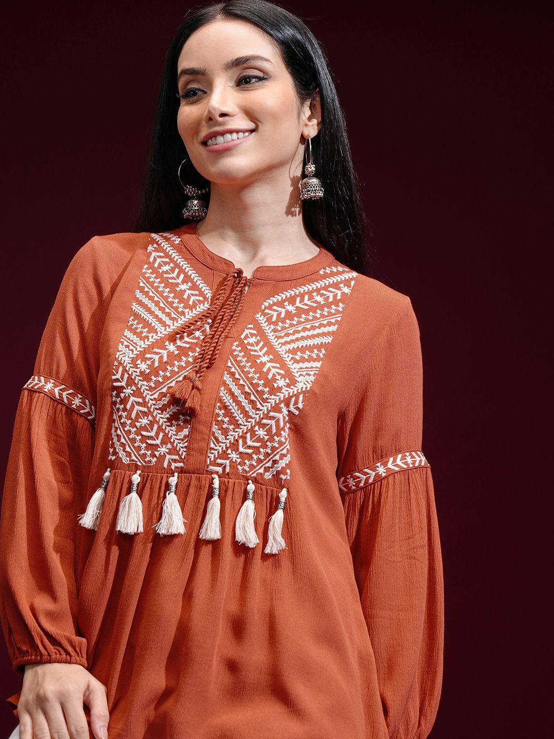 

Vishudh Women Print Mandarin Collar Self Design Top, Rust