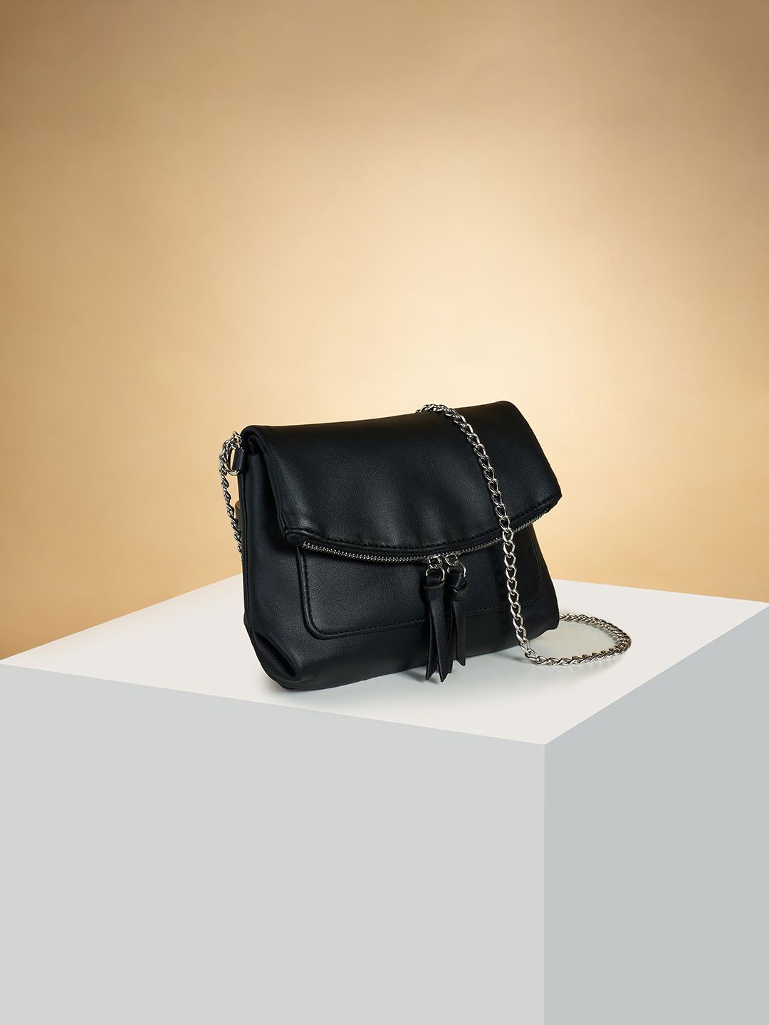 

Forever Glam by Pantaloons PU Structured Sling Bag with Tasselled, Black