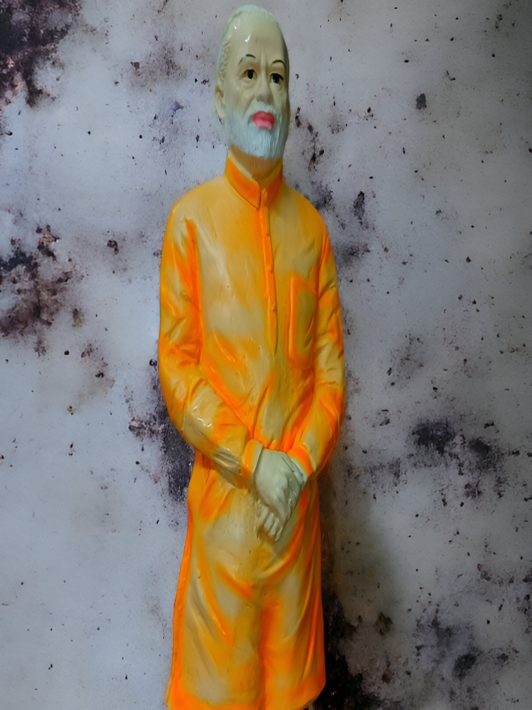 

Vrinban International Orange & Yellow Shri Narender Modi Figurine Showpiece