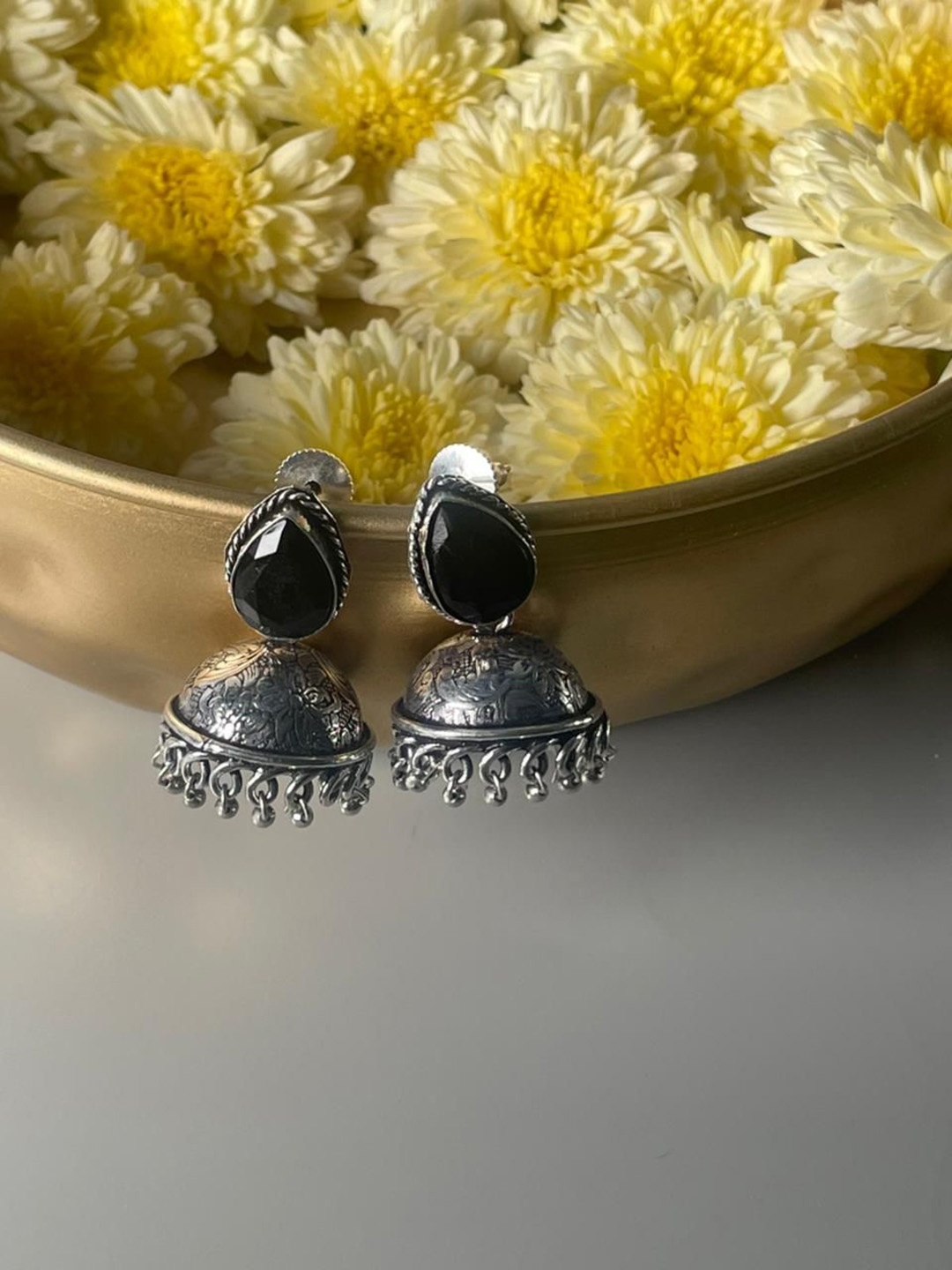 

Niska Artificial Stones Studded Contemporary Jhumkas, Silver