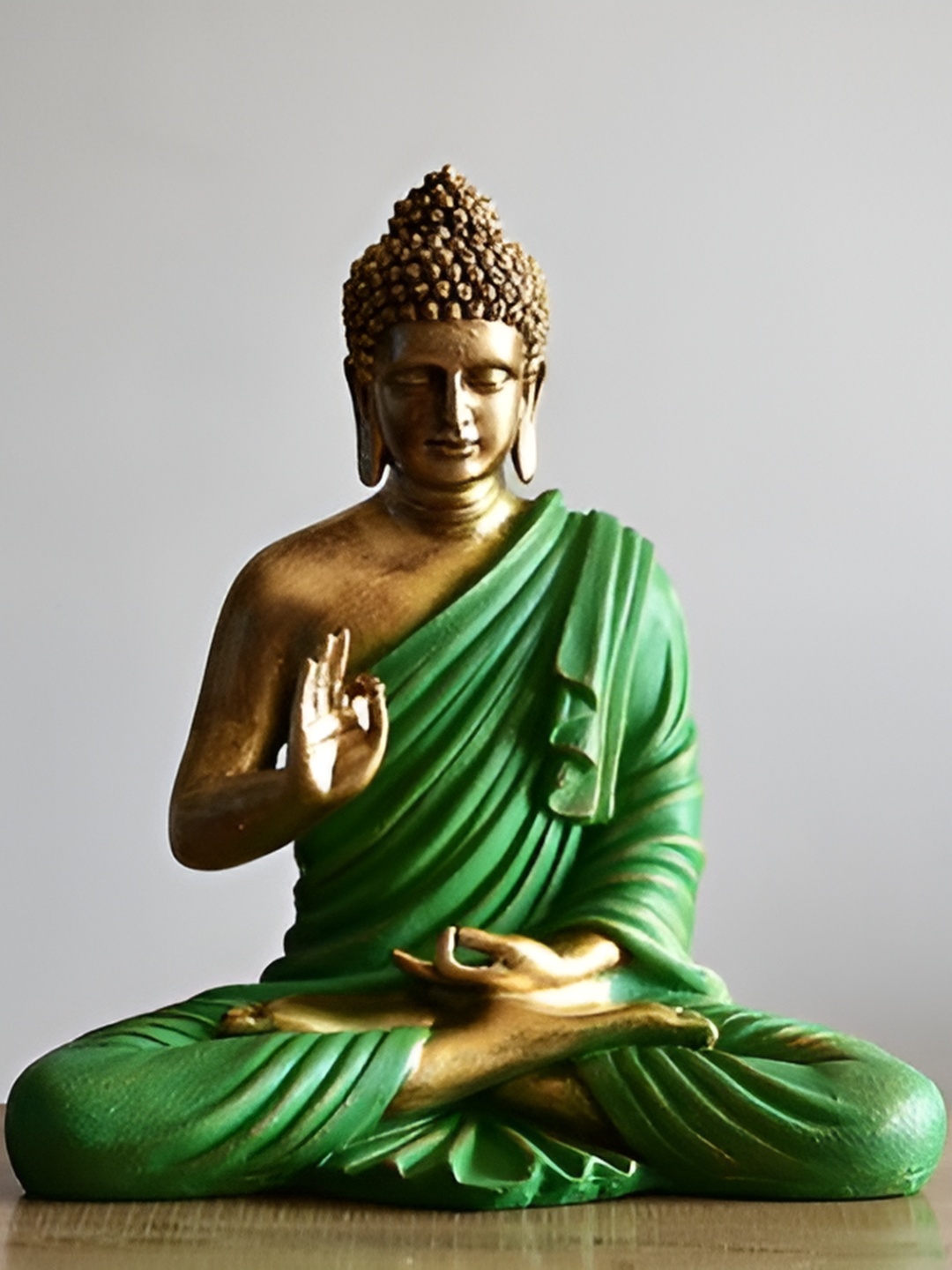 

Vrinban International Green & Gold Toned Buddha Idol Showpiece