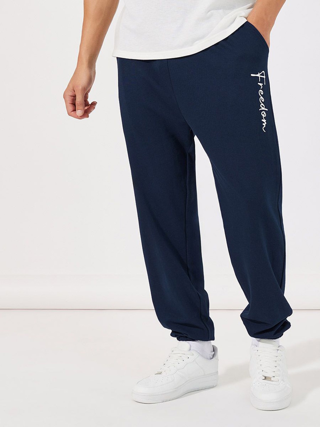 

Styli Men Navy Blue Typography Printed Relaxed Fit Joggers Track Pants