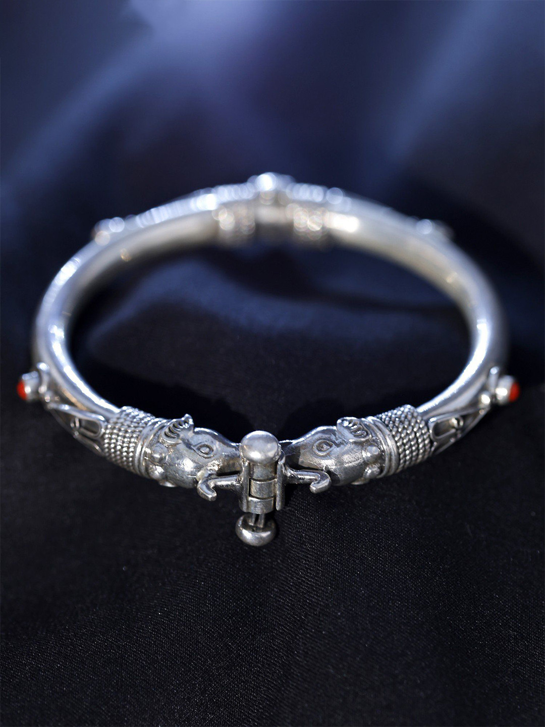 

Exotic India Ethnic Elephant Openable Sterling Silver Bracelet With Coral Gemstone