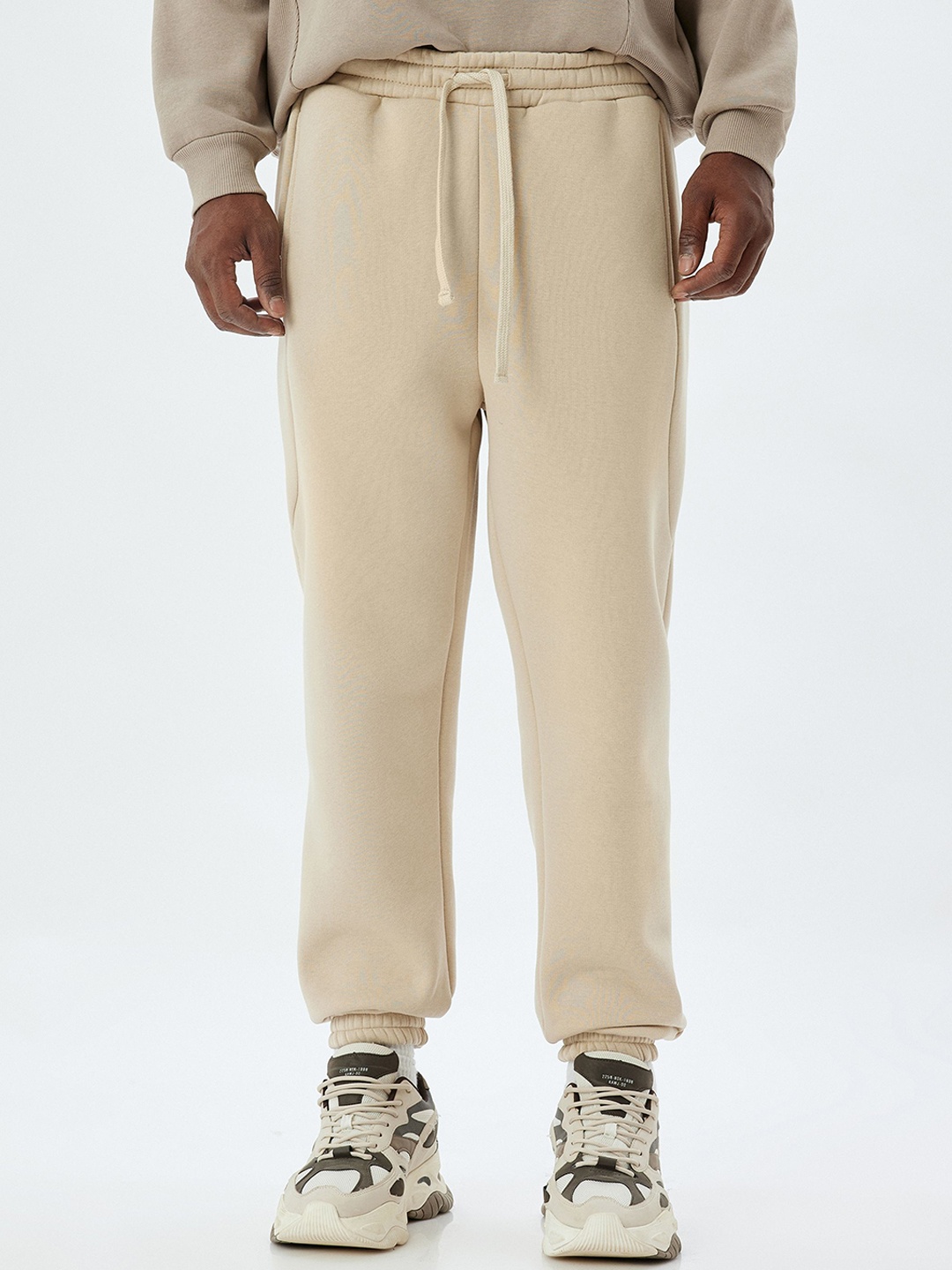 

Koton Men Mid Rise Regular Fit Joggers, Beige