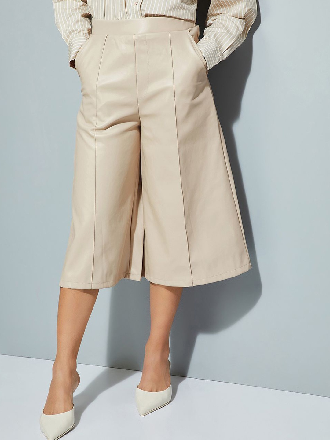 

Max ALAYA F x URB_N Women Solid Flared Leather Trousers, Beige