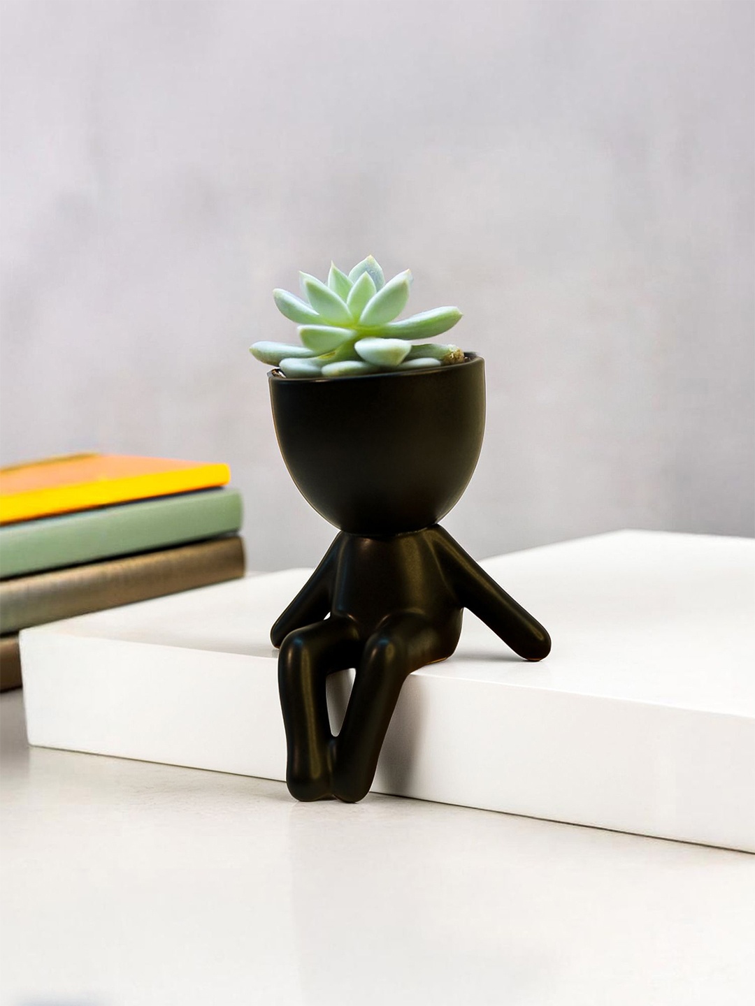 

Ekhasa Black Ceramic Figure Planters
