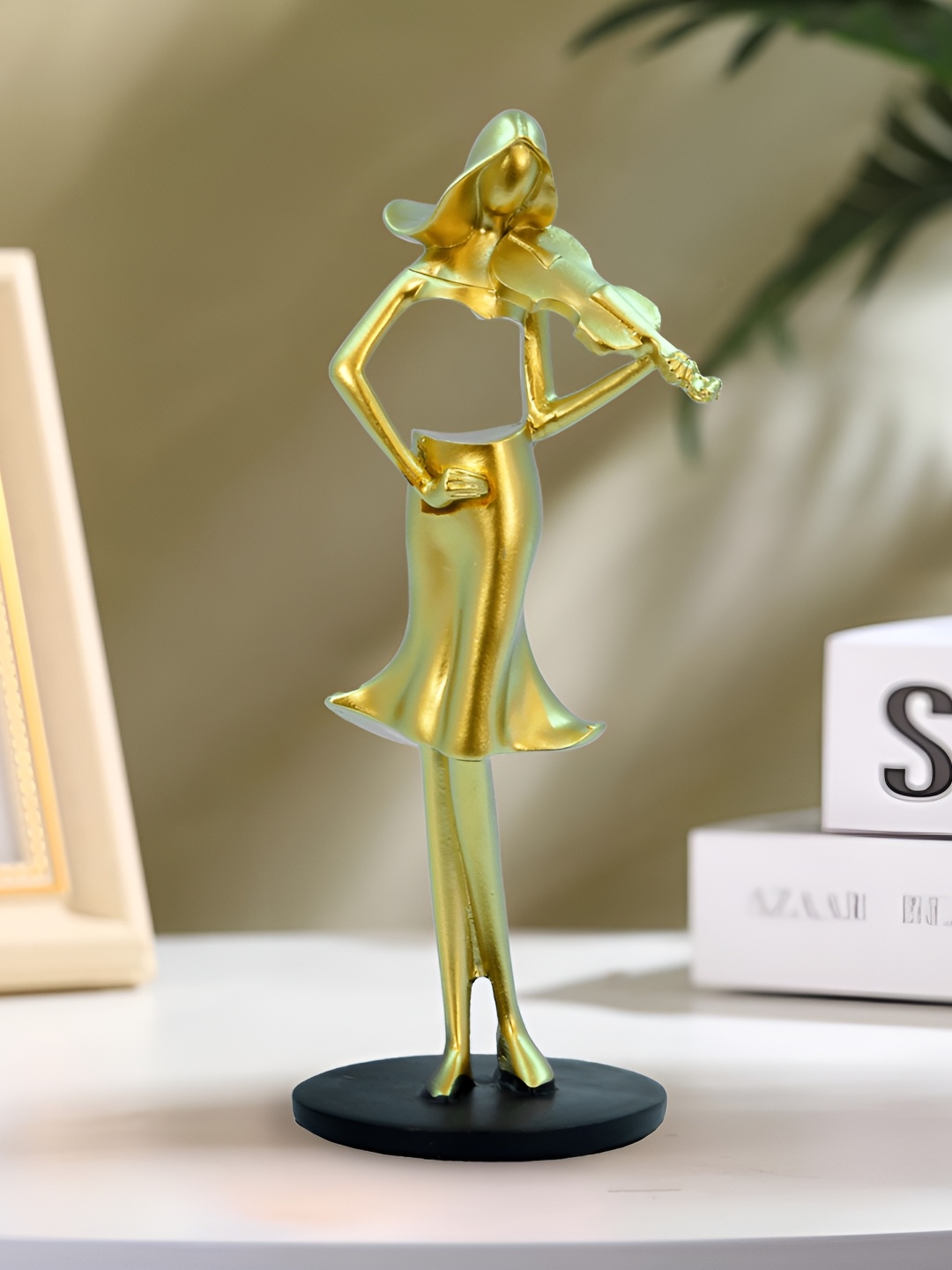 

Aura Gold-Toned Other Figurine Showpiece