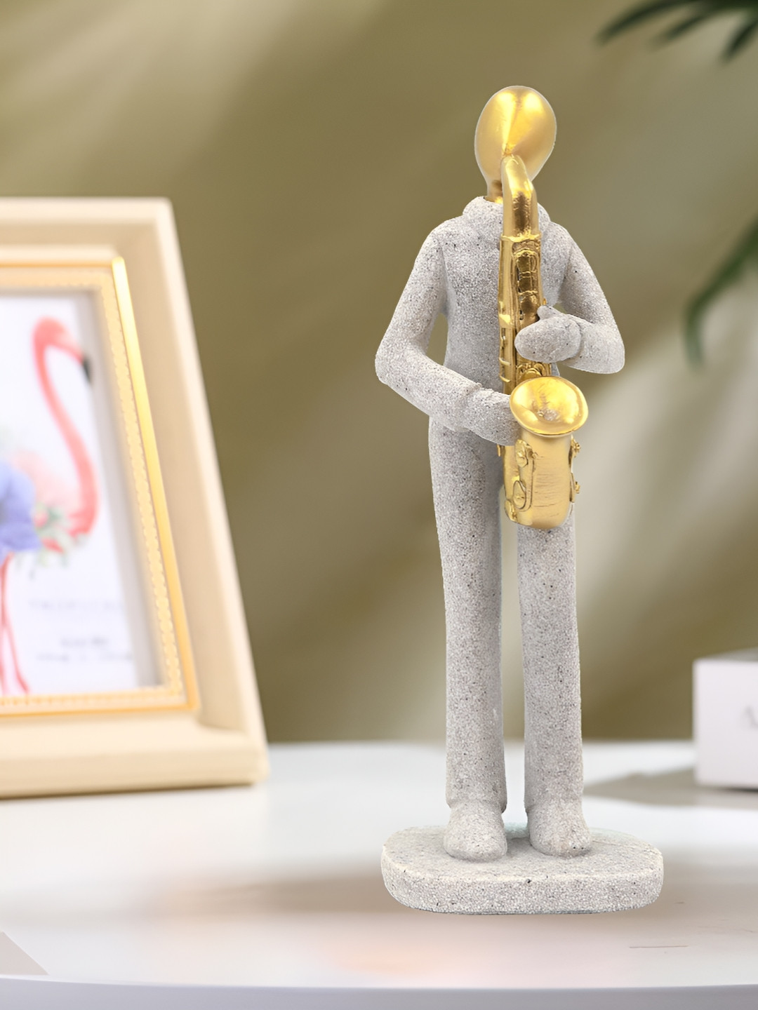 

Aura Grey & Gold-Toned Other Figurine Showpiece