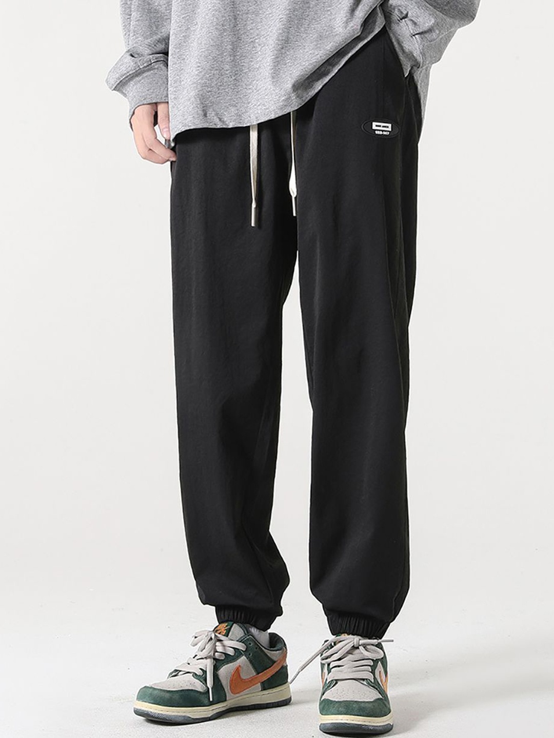 

StyleCast x Revolte Men Regular Fit Mid-Rise Easy Wash Joggers, Black