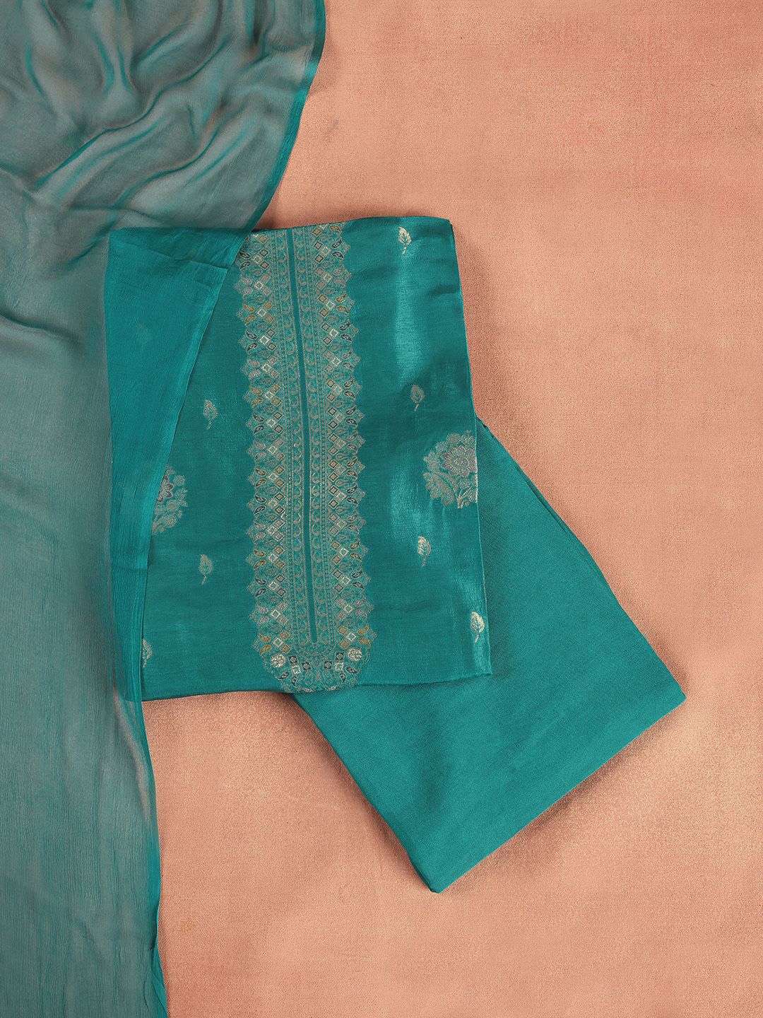 

Libas Teal Green Floral Woven Design Zari Unstitched Dress Material
