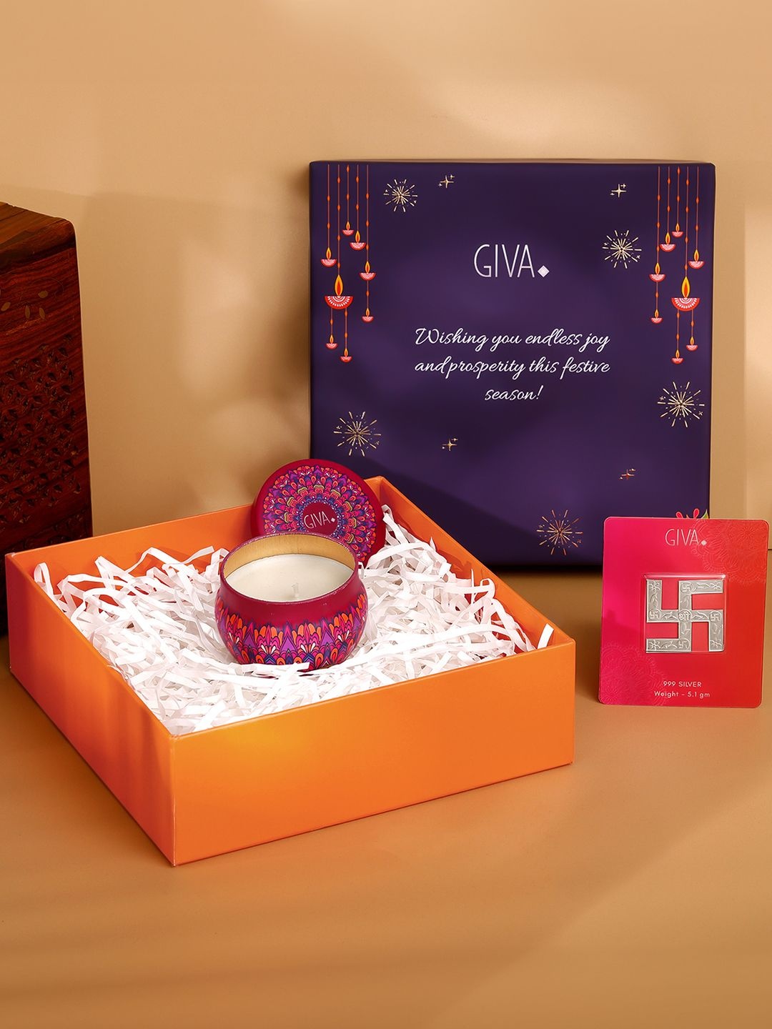 

GIVA Silver Toned & Maroon 2 Pieces Swastik & Candles Home Gift Set