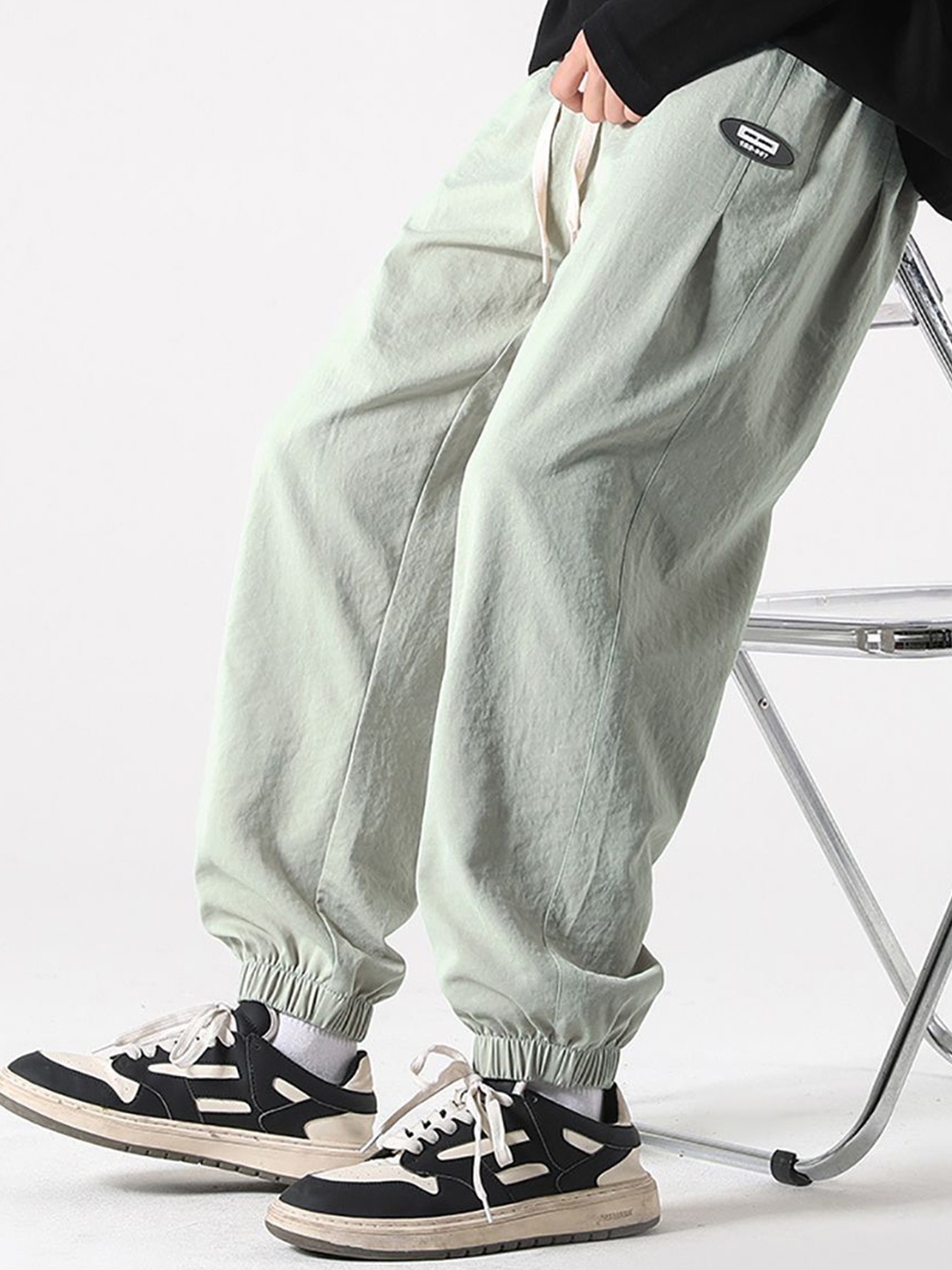 

StyleCast x Revolte Men Solid Easy Wash Mid-Rise Loose Fit Joggers, Grey