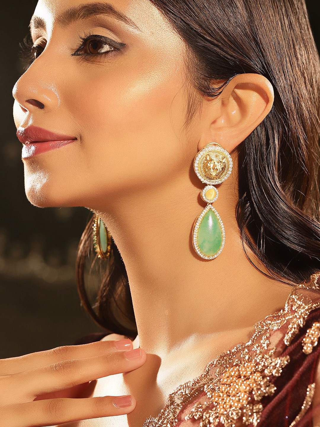 

Priyaasi Gold -Plated AD-Stone Studded Tiger Faced Teardrop Shaped Drop Earrings