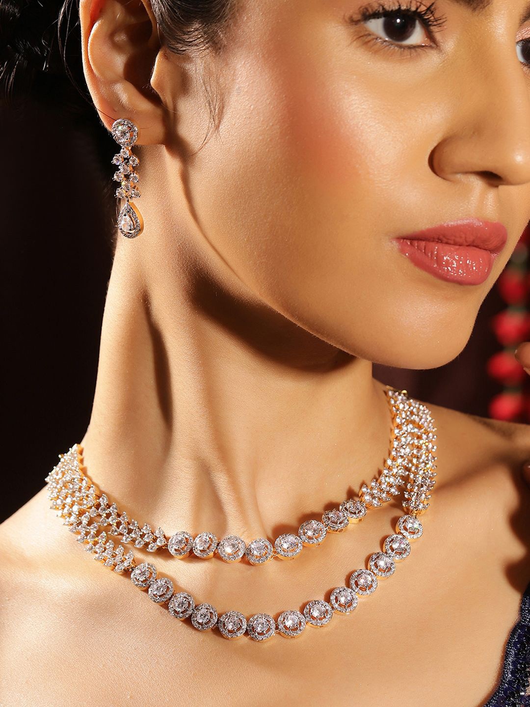 

Priyaasi Gold-Plated American Diamond Studded Two Layered Jewellery Set