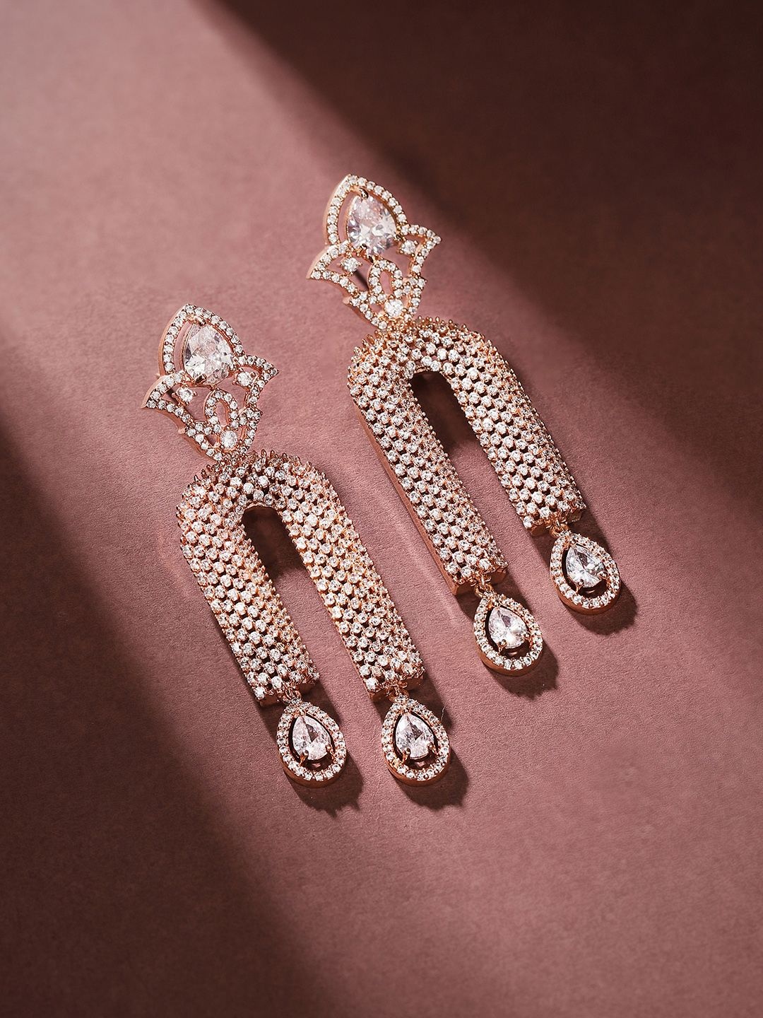 

Priyaasi Rose Gold-Plated American Diamond-Stone Studded Teardrop Shaped Drop Earrings