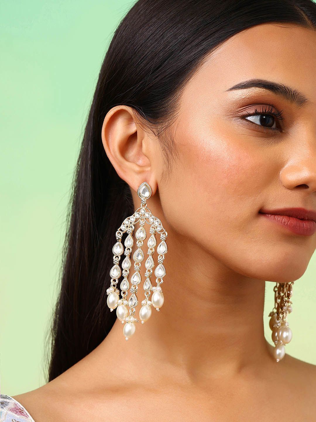 

Priyaasi Gold-Plated Kundan Stone Studded & Beaded Teardrop Shaped Tasselled Drop Earrings