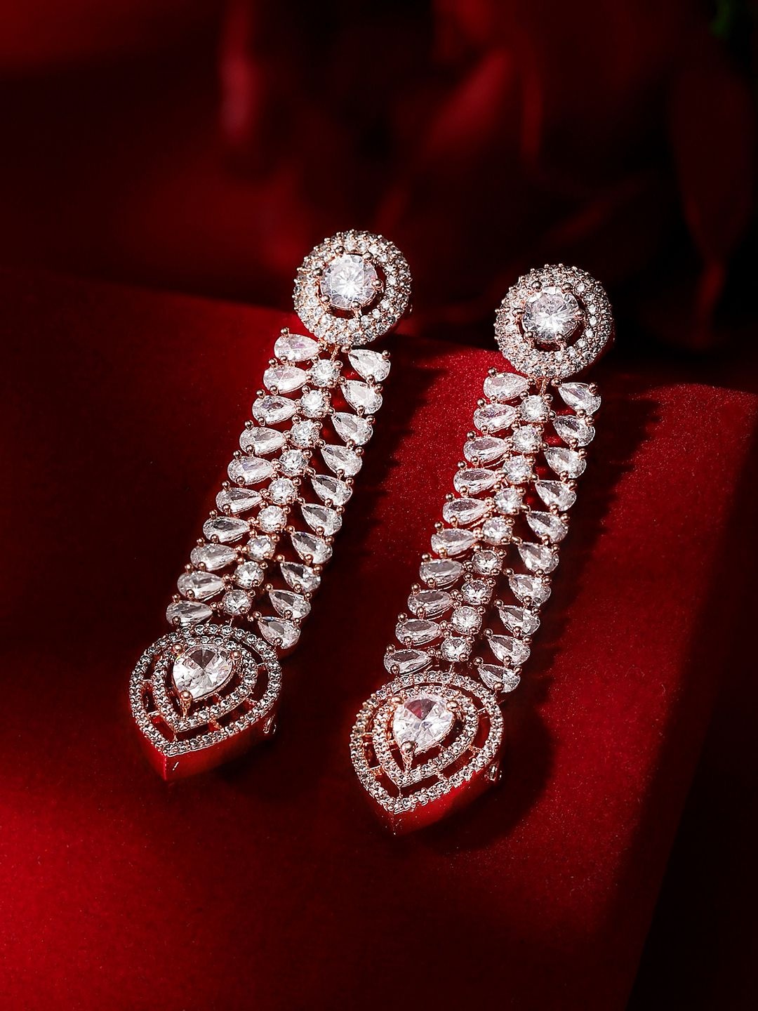 

Priyaasi Rose Gold-Plated American Diamond Stone Studded Leaf Shaped Drop Earrings