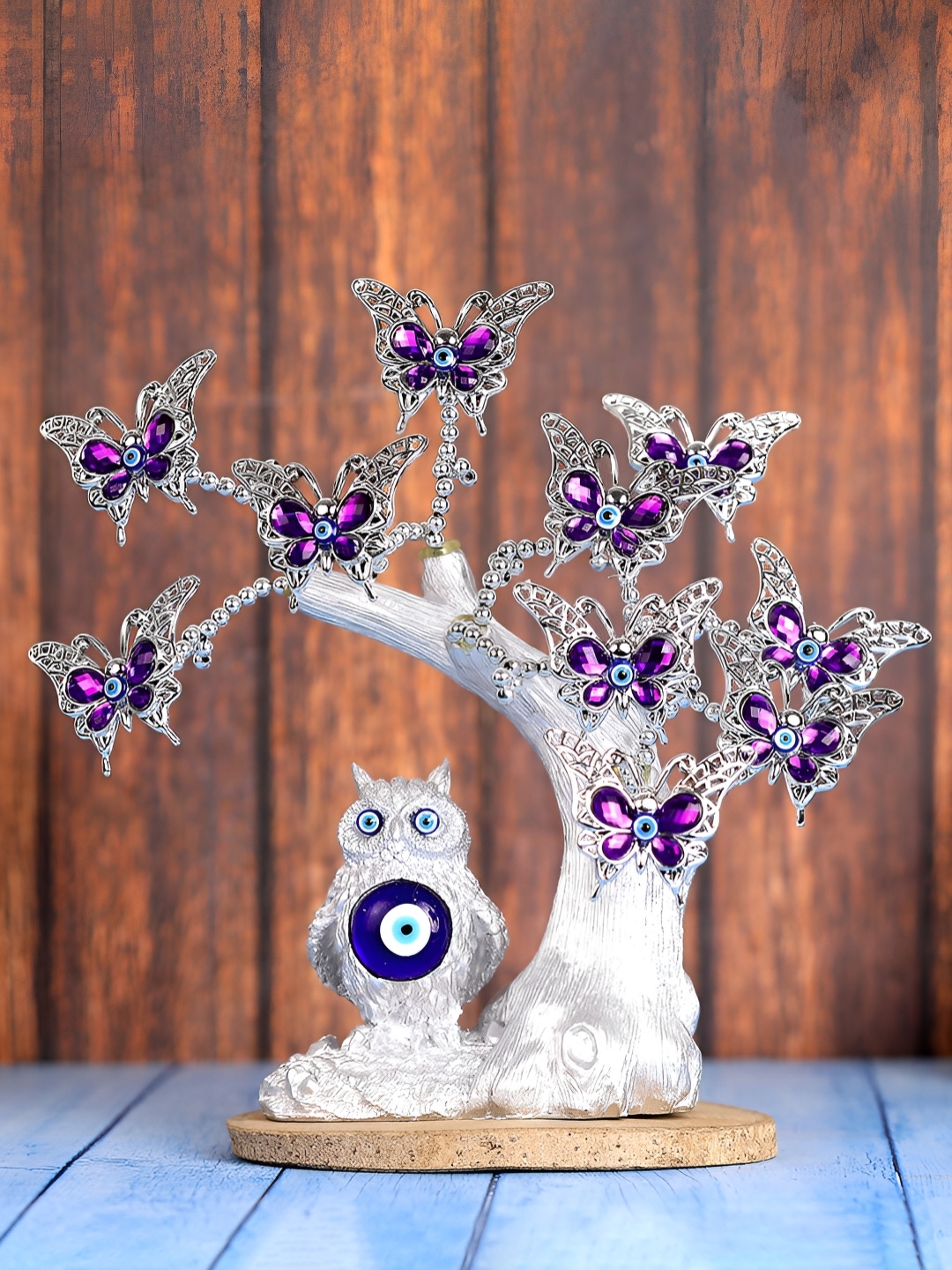 

FOLIYAJ Silver-Toned Figurine Showpiece