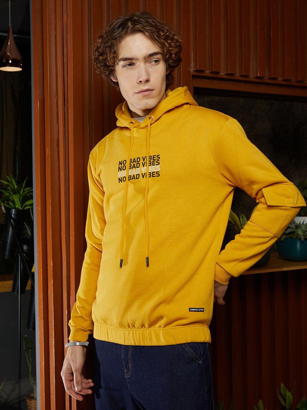 

Campus Sutra Men Cotton Typography Printed Hooded Long Sleeves Pullover Sweatshirt, Yellow