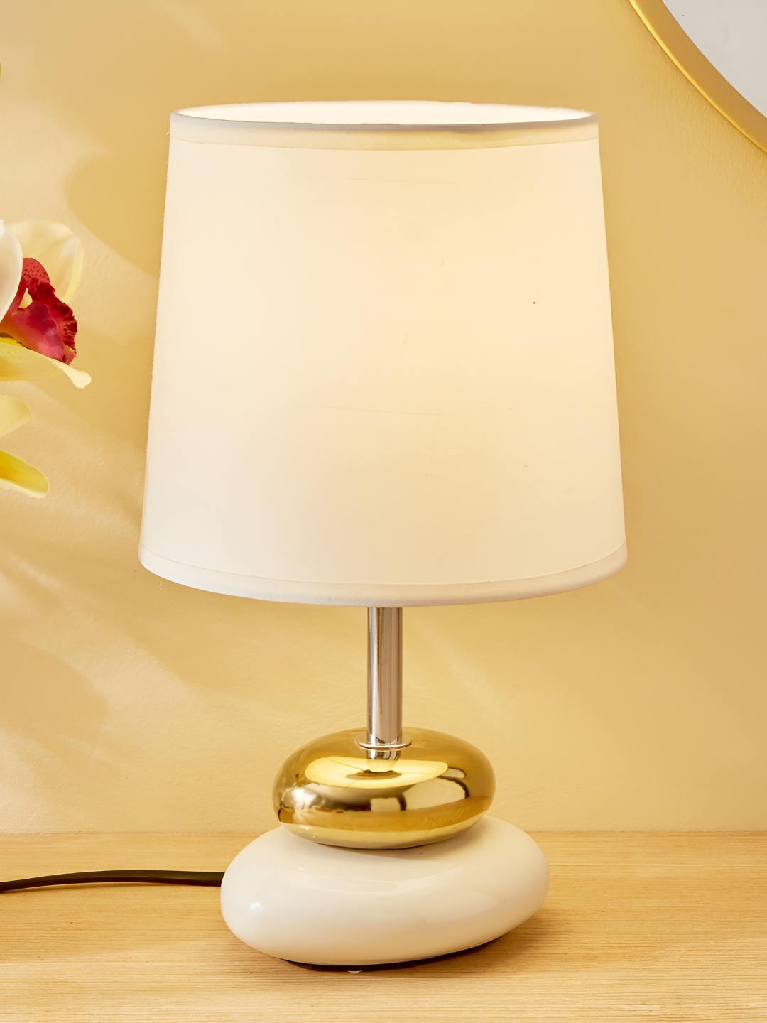 

Home Centre Glint Pebble White Ceramic Cylindrical Shaped Table Lamp