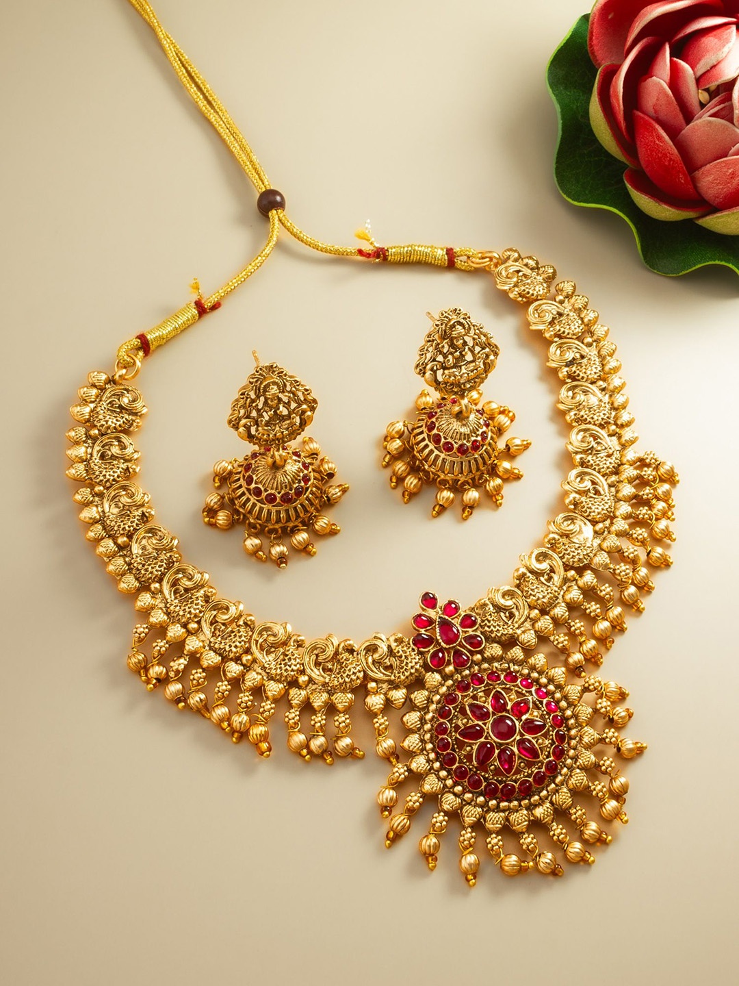 

aadita Gold-Plated Stone-Studded & Beaded Jewellery Set