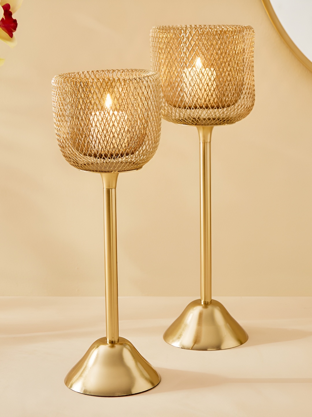 

Home Centre Majestic Mesh Gold-Toned & Transparent 2 Pieces Metal Pedestal Candle Holders