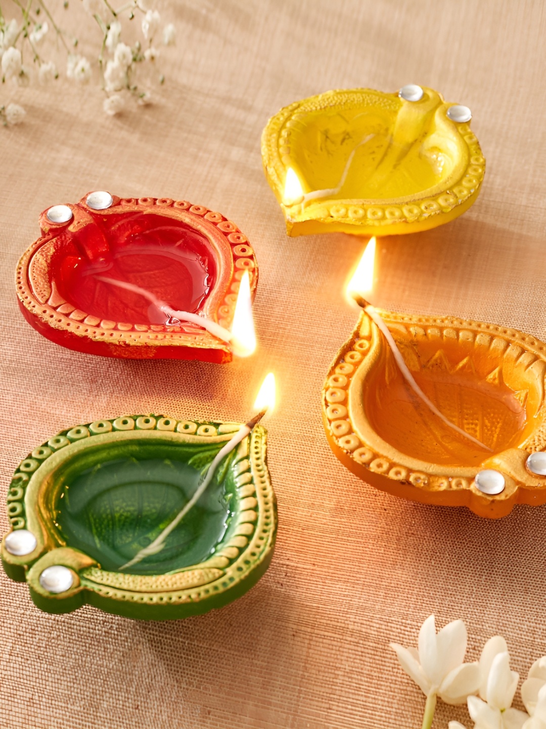 

Home Centre Set Of 4 Green & Red Leaf Diyas