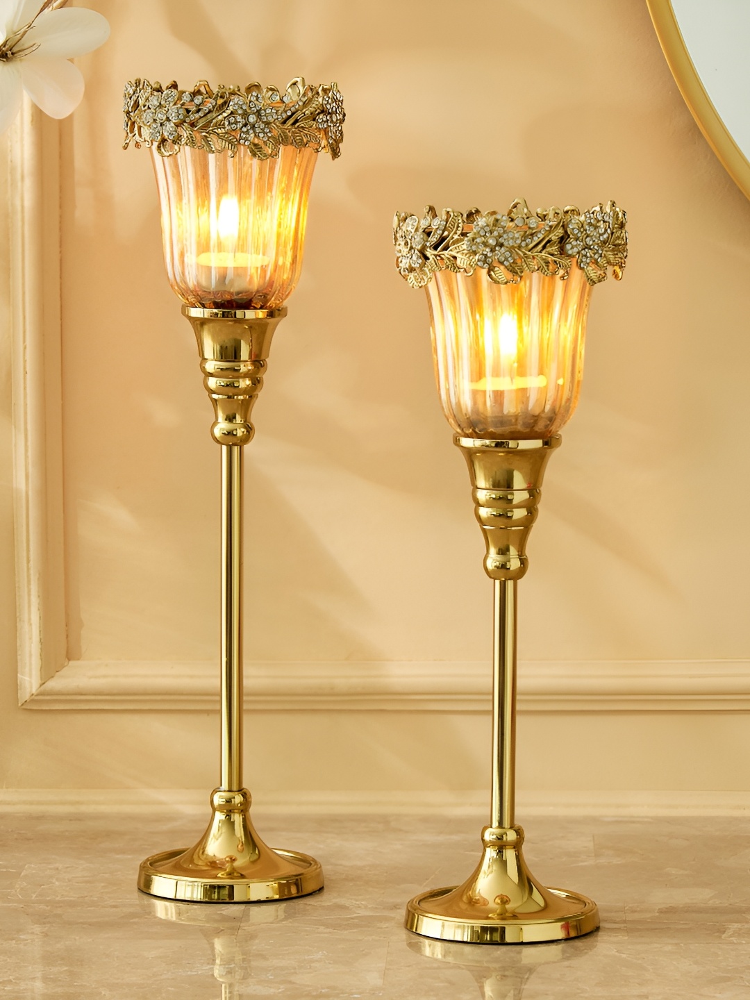 

Home Centre Fables Glitz Gold-Toned 2 Pcs Pedestal Floral Votive Candle Holders