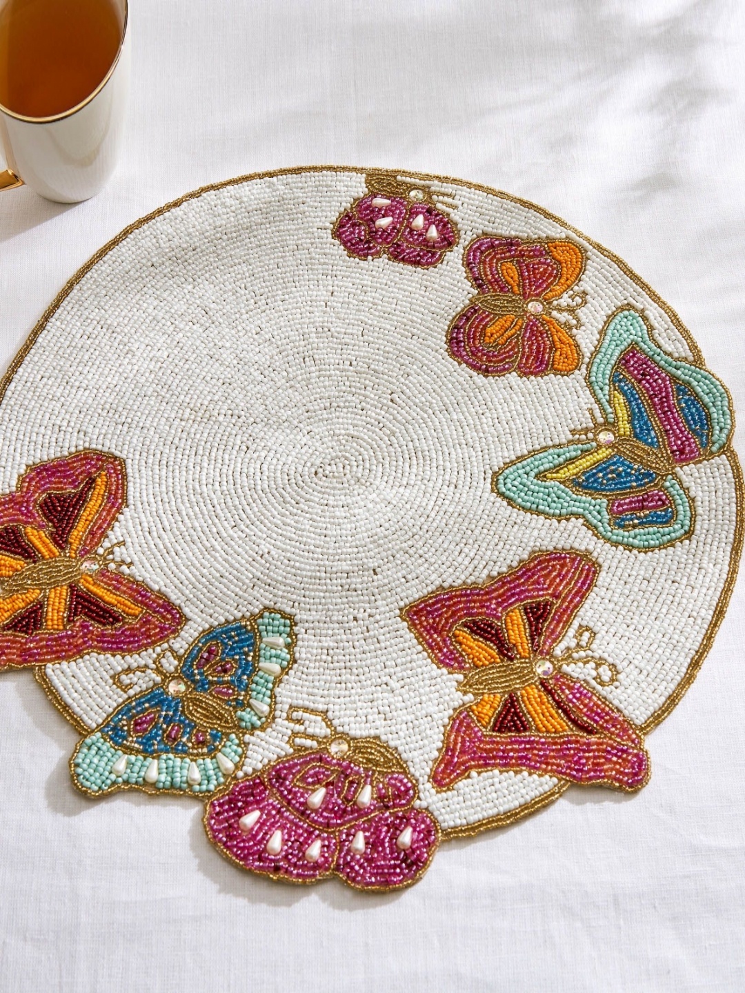 

Home Centre Corsica Moksha White & Brown Beaded Round Table Placemats