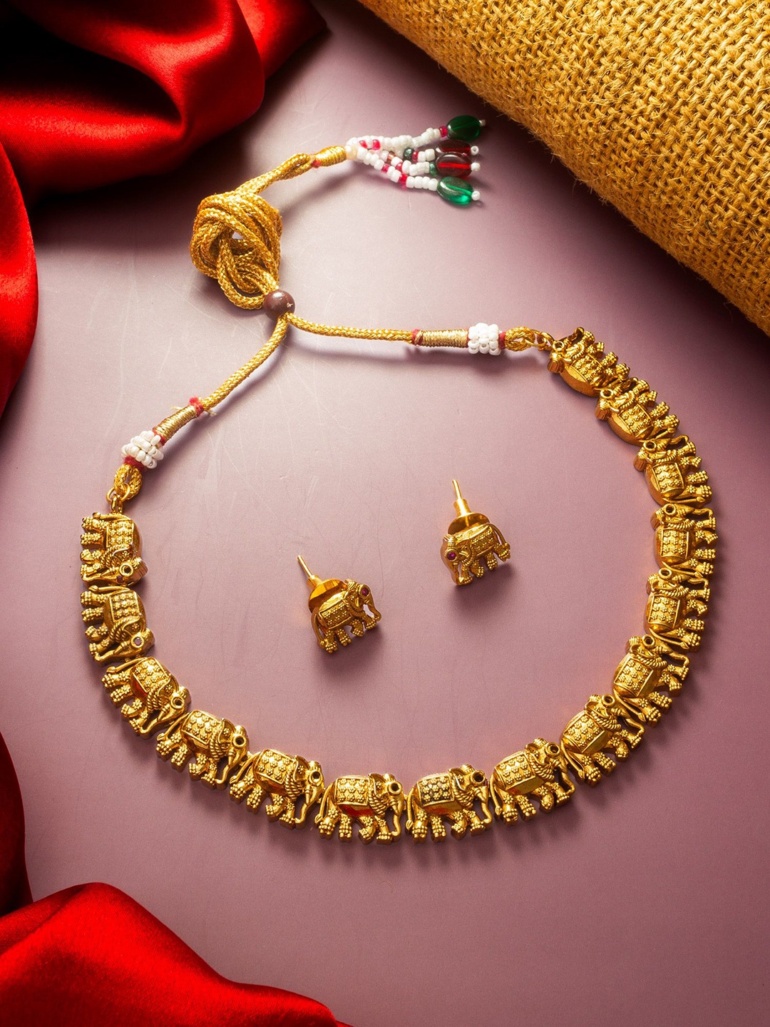 

aadita Gold-Plated Stone Studded & Beaded Temple Choker Jewellery Set