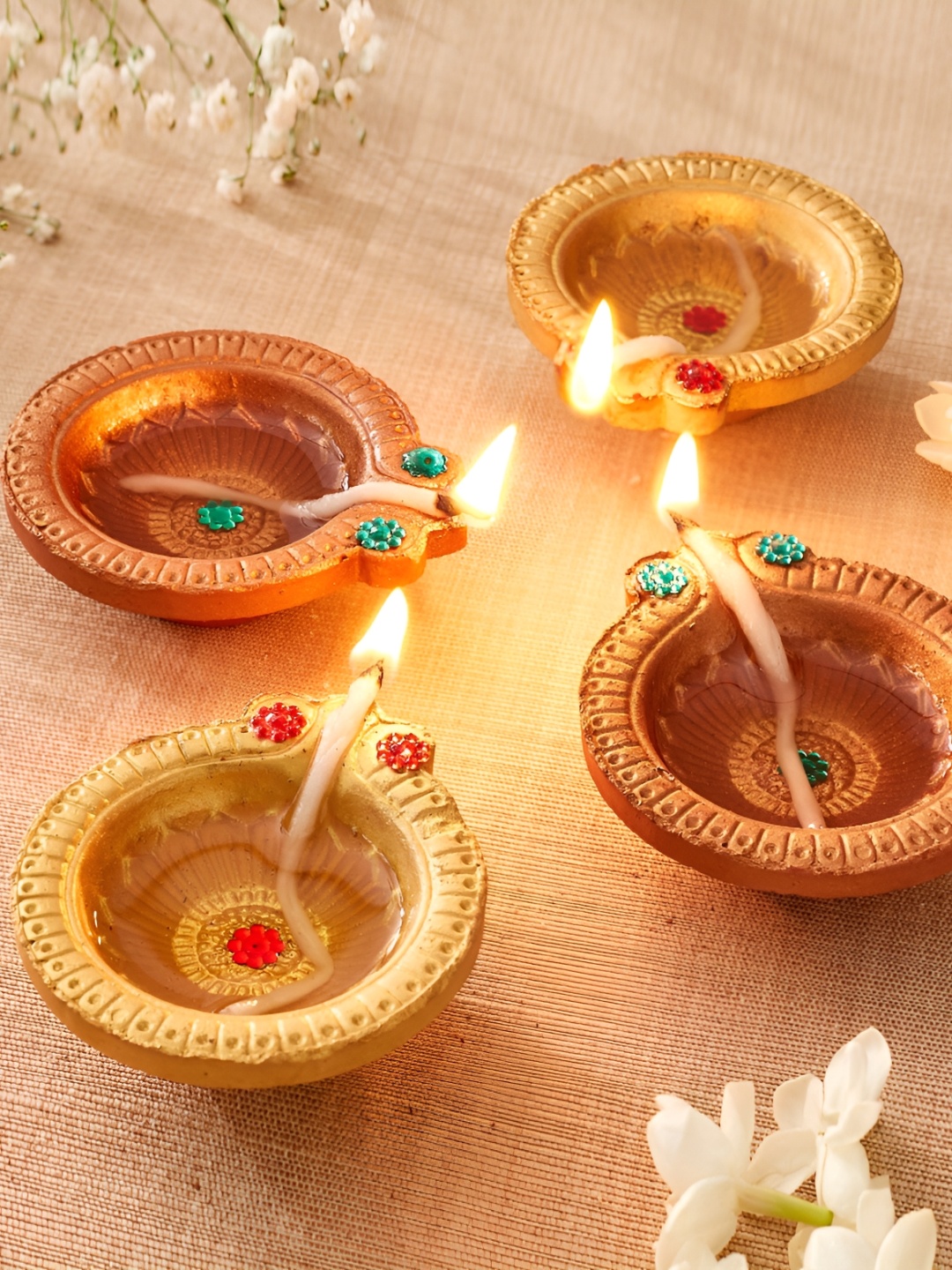 

Home Centre Set Of 4 Earthen Clay Embellished Leaf Diyas, Brown