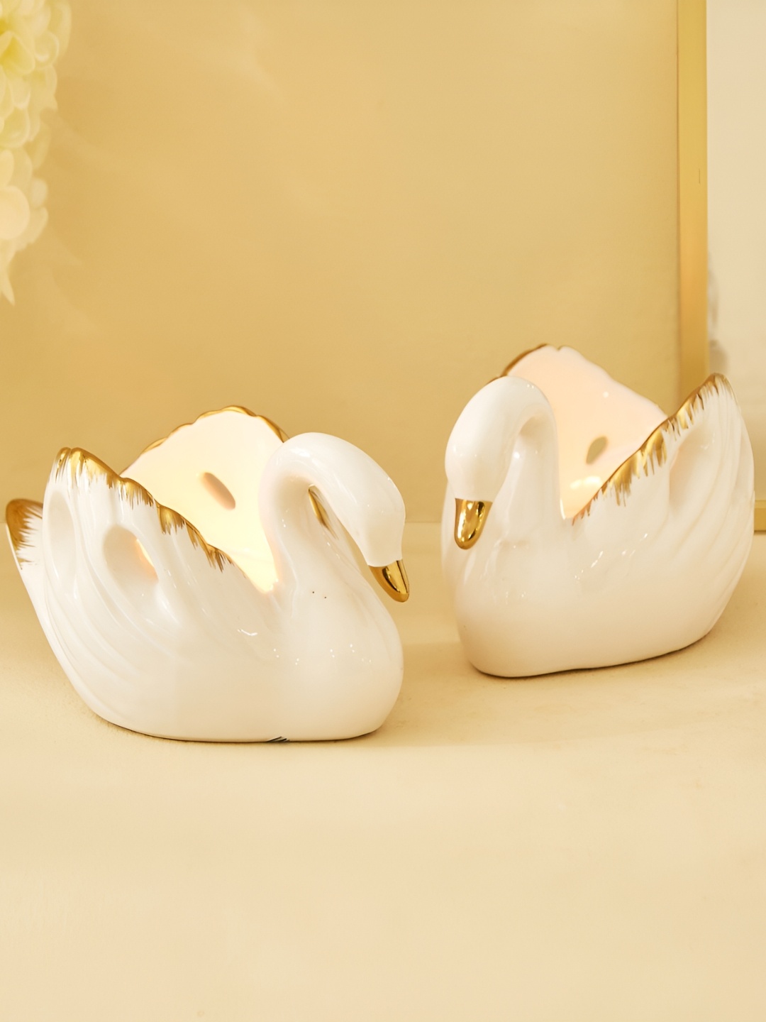 

Home Centre Stellar Fantasy White & Gold-Toned 2 Pieces Ceramic Swan T-Light Holders