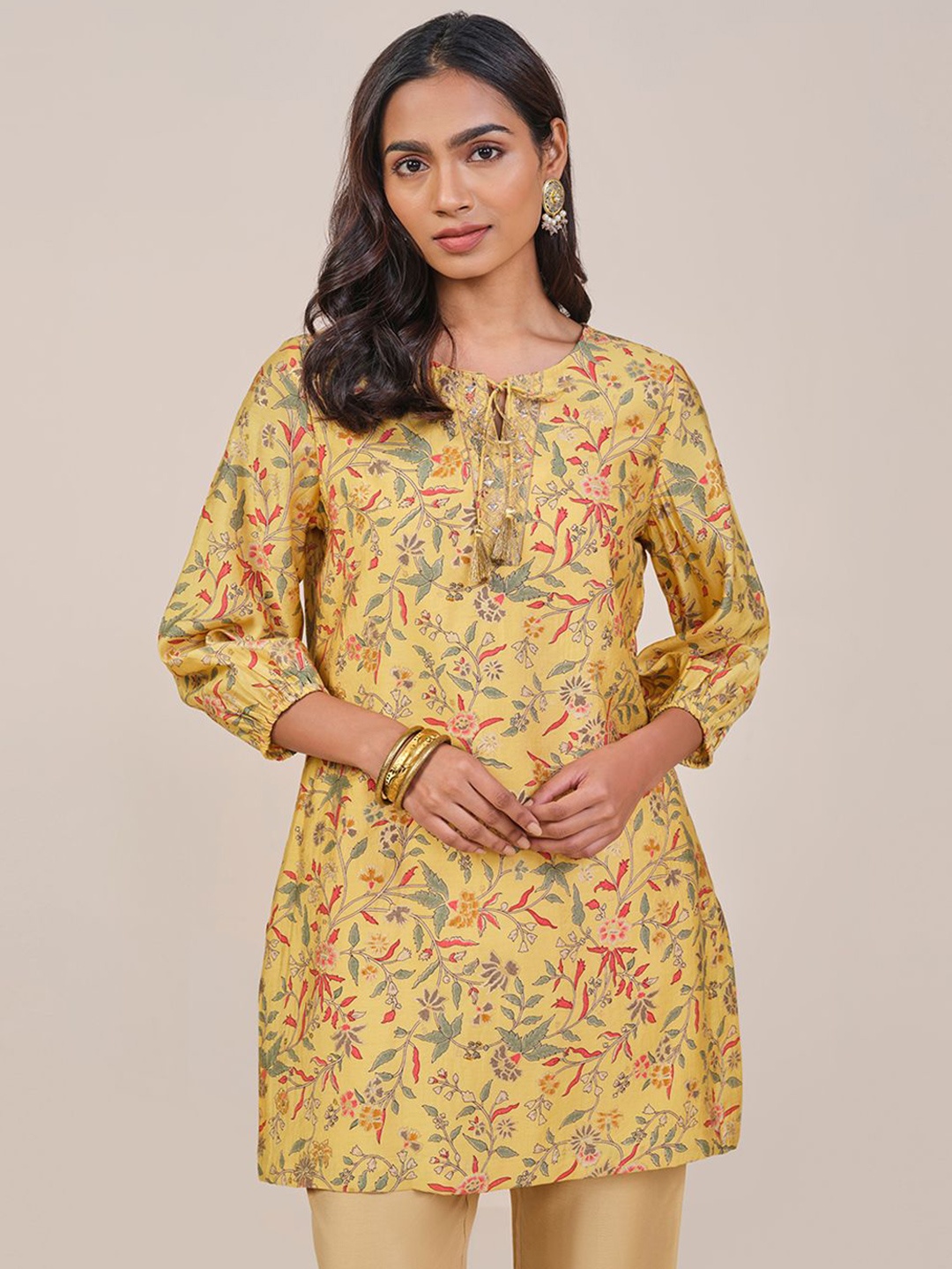 

Global Desi Women Floral Printed Tie Up Neck A-Line Kurti, Yellow