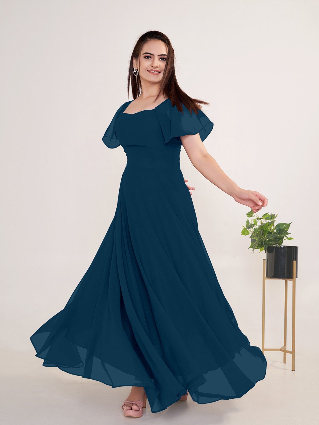 

Raiyani Enterprise Georgette Solid Square Neck Flared Sleeves Maxi Dress, Blue