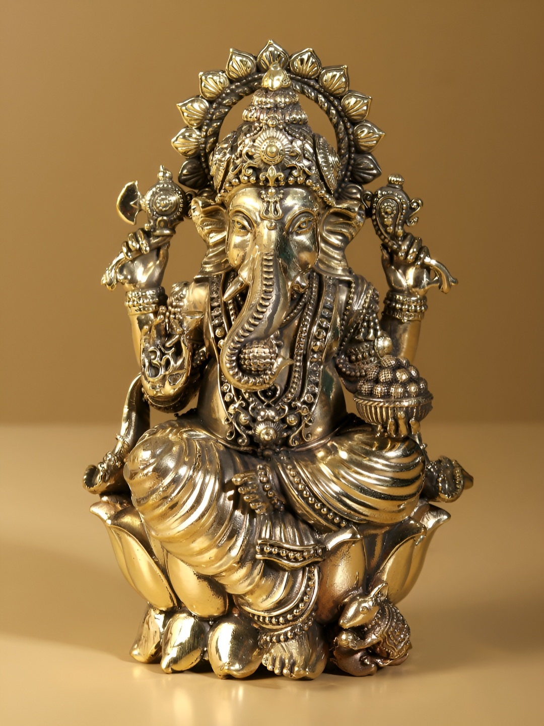 

Exotic India Superfine Lord Ganapati Seated on Lotus - Brass Statue, Gold