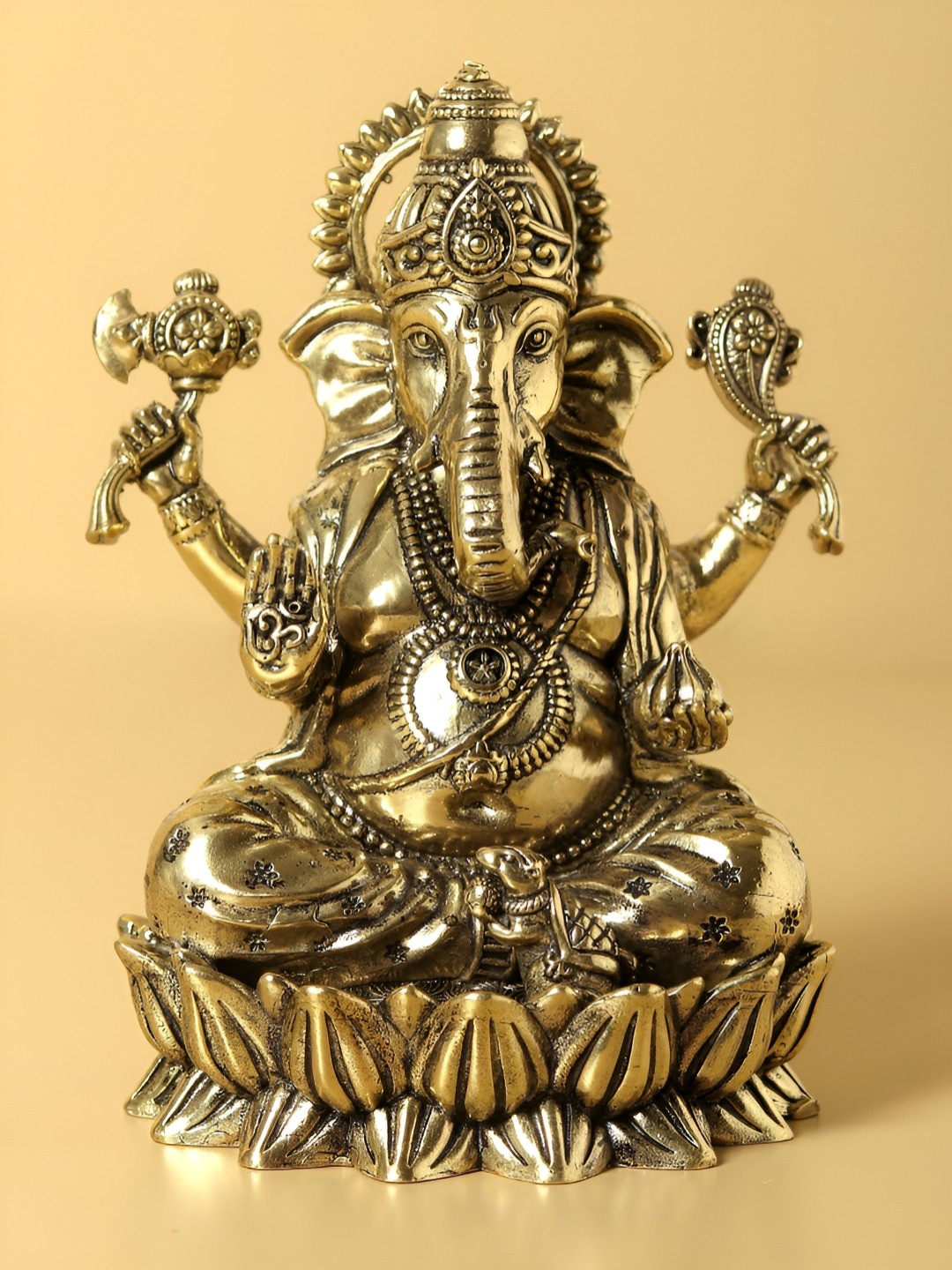 

Exotic India Small Superfine Chaturbhuja Lord Ganesha Idol Seated on Lotus, Gold